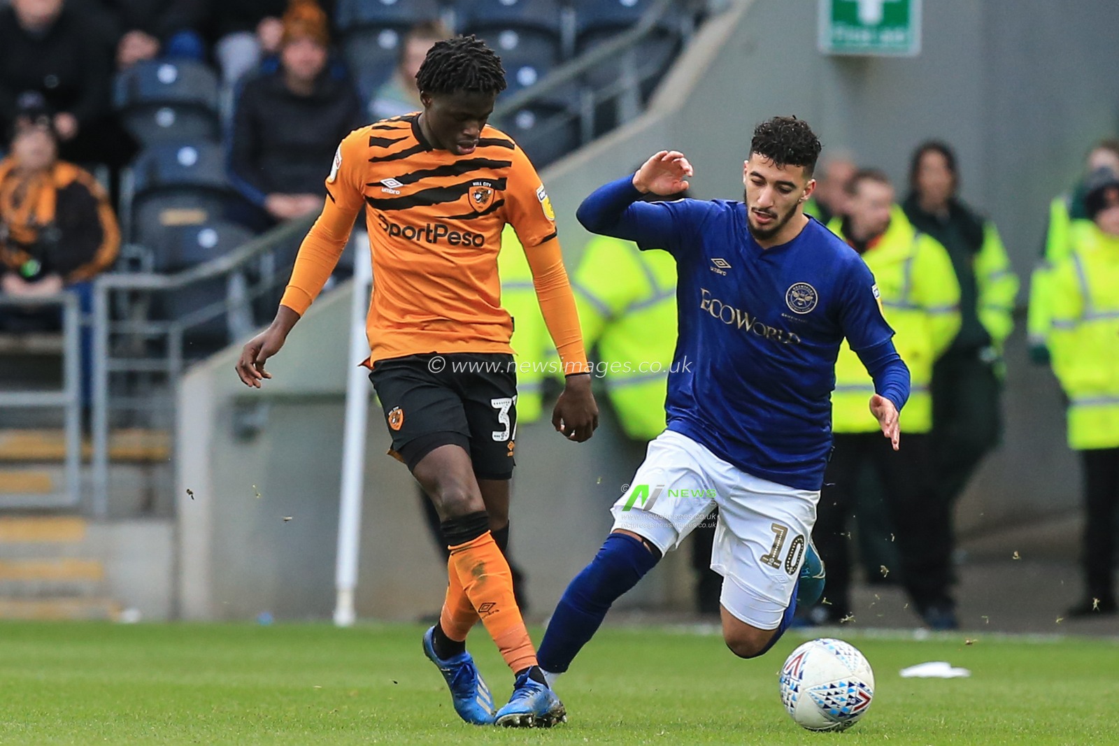 1st February 2020, KC Stadium, Kingston upon Hull, England; Sky Bet Championship, Hull City v Brentford : Leonardo Da Silva Lopes (37) of Hull City and Said Benrahma (10) of Brentford challenge for the ball
