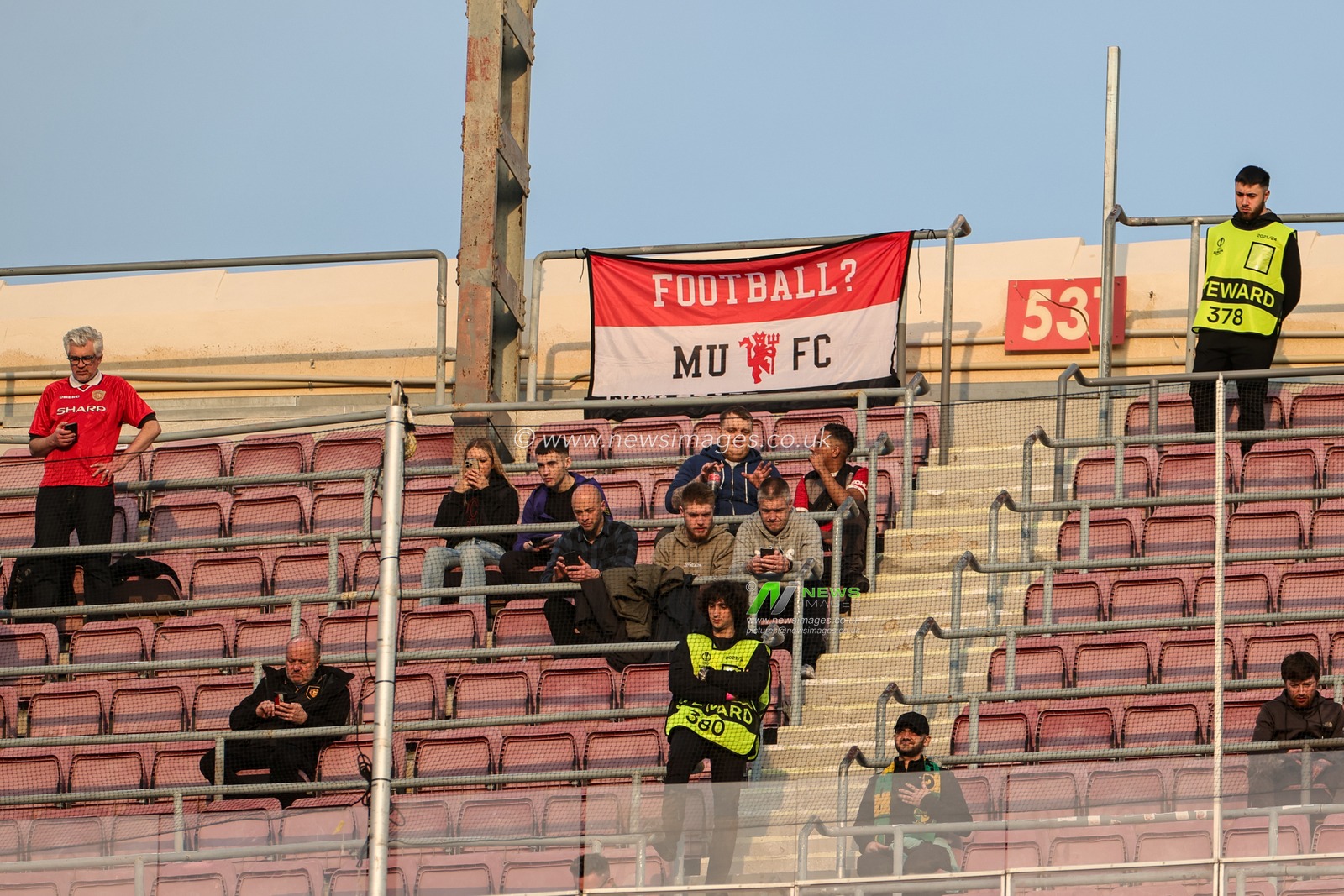 United fans behind netting watched by a steward before the UEFA Europa League Knockout Round Play-Offs Barcelona vs Manchester United at Spotify Camp Nou, Barcelona, Spain, 16th February 2023

(Photo by Mark Cosgrove/News Images)