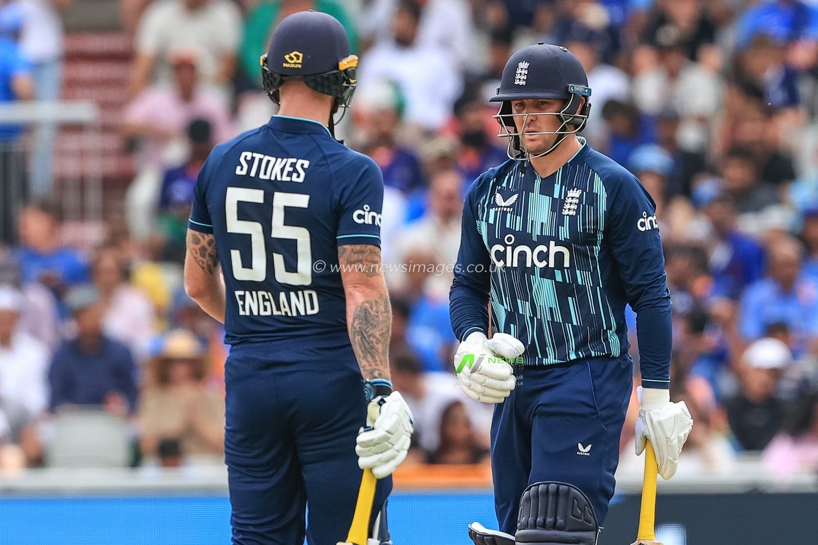 Jason Roy of England walks to Ben Stokes of England after he hits another boundary