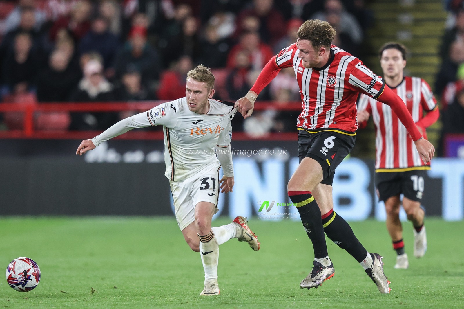 Ollie Cooper of Swansea City is fouled by Harry Souttar of Sheffield United during the Sky Bet Championship match Sheffield United vs Swansea City at Bramall Lane, Sheffield, United Kingdom, 2nd October 2024

(Photo by Alfie Cosgrove/News Images)