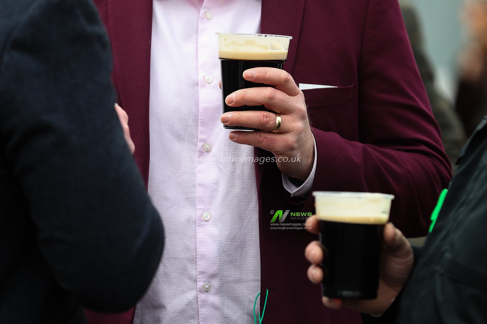 Racegoers with a pint of Guinness during the Cheltenham Festival 2025 St Patrickâ€™s Thursday at Cheltenham Racecourse, Cheltenham, United Kingdom, 13th March 2025

(Photo by Gareth Evans/News Images)