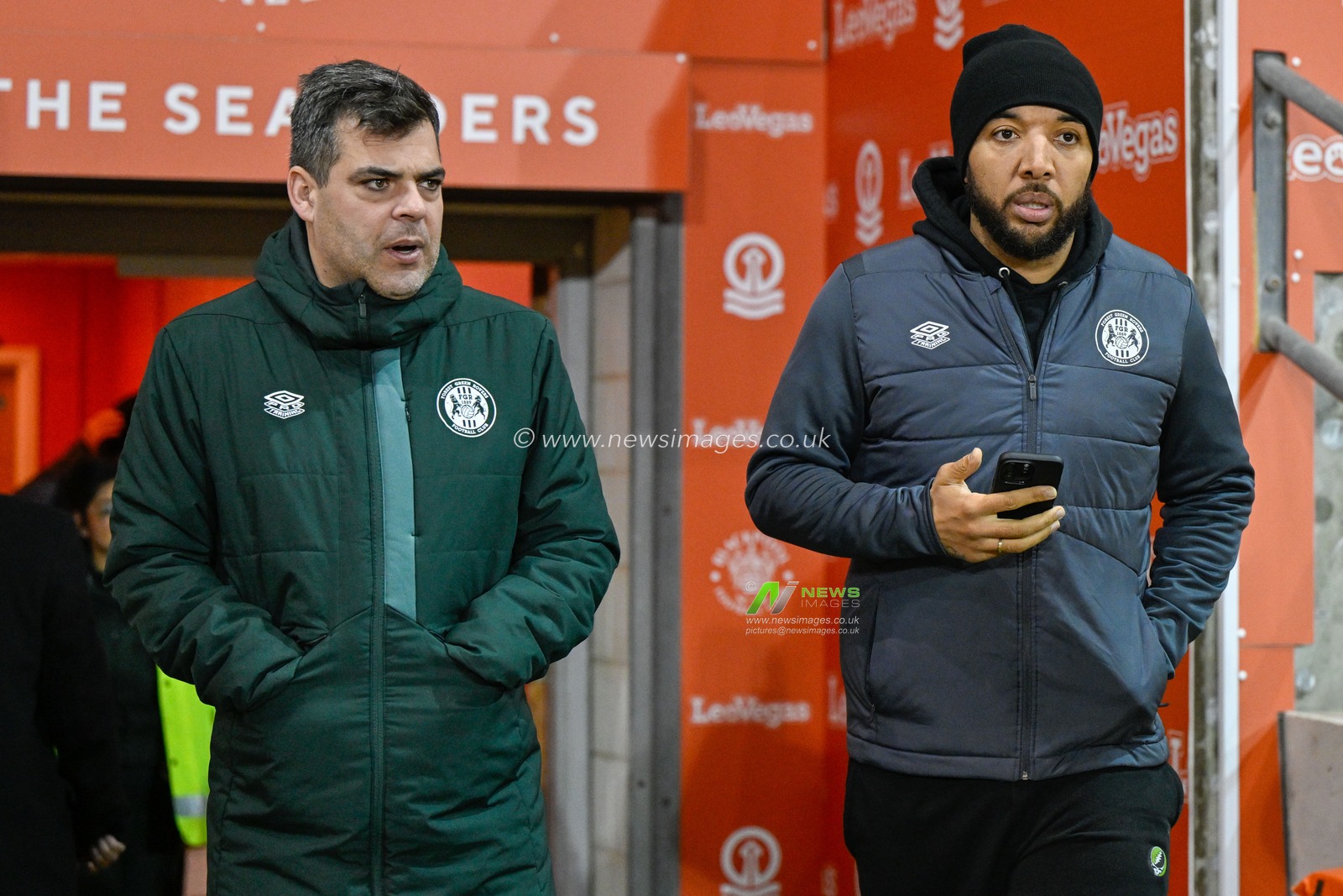 Troy Deeney #14 of Forest Green Rovers walks out with David Horseman manager Forest Green Rovers to inspects the pitch ahead of the match, during the Emirates FA Cup Second Round match Blackpool vs Forest Green Rovers at Bloomfield Road, Blackpool, United Kingdom, 19th December 2023

(Photo by Cody Froggatt/News Images)