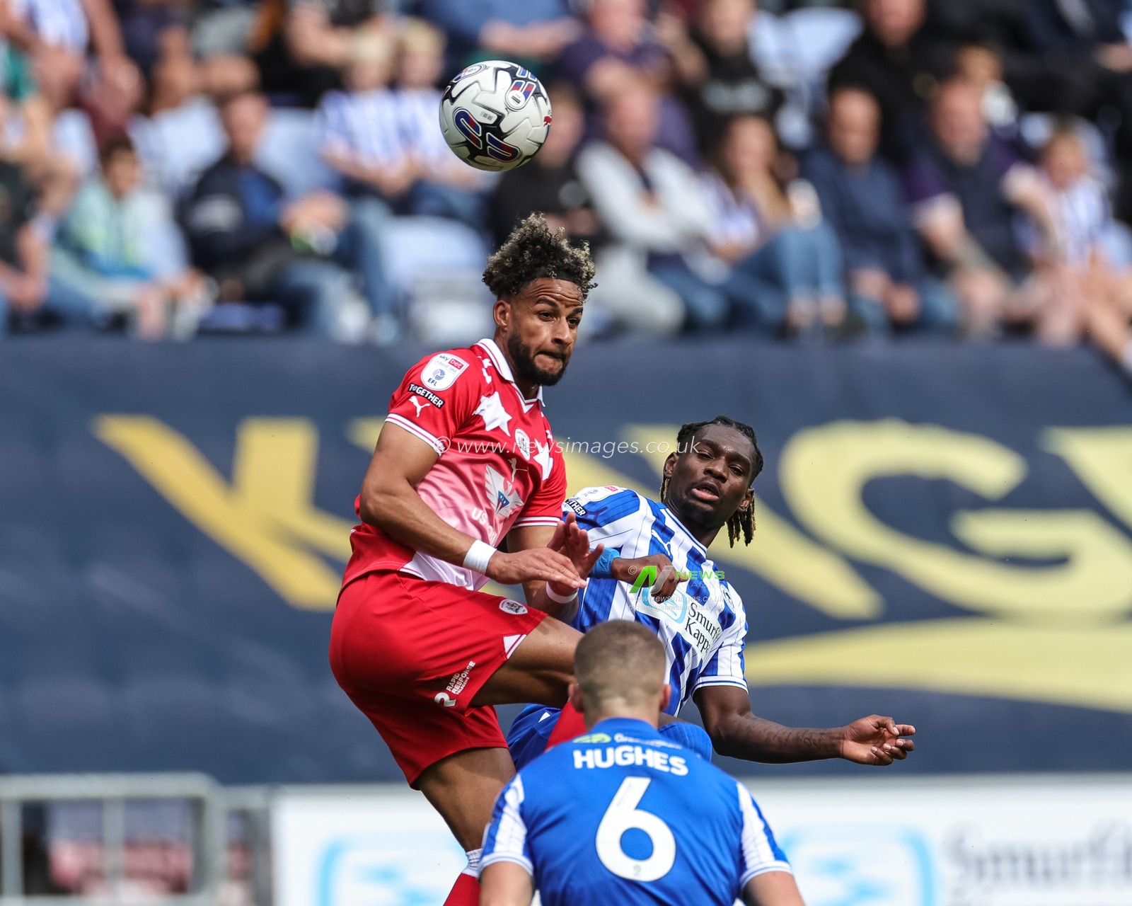 Barry Cotter #17 of Barnsley and Baba Adeeko #26 of Wigan Athletic battle for the ball during the Sky Bet League 1 match Wigan Athletic vs Barnsley at DW Stadium, Wigan, United Kingdom, 26th August 2023

(Photo by Mark Cosgrove/News Images)