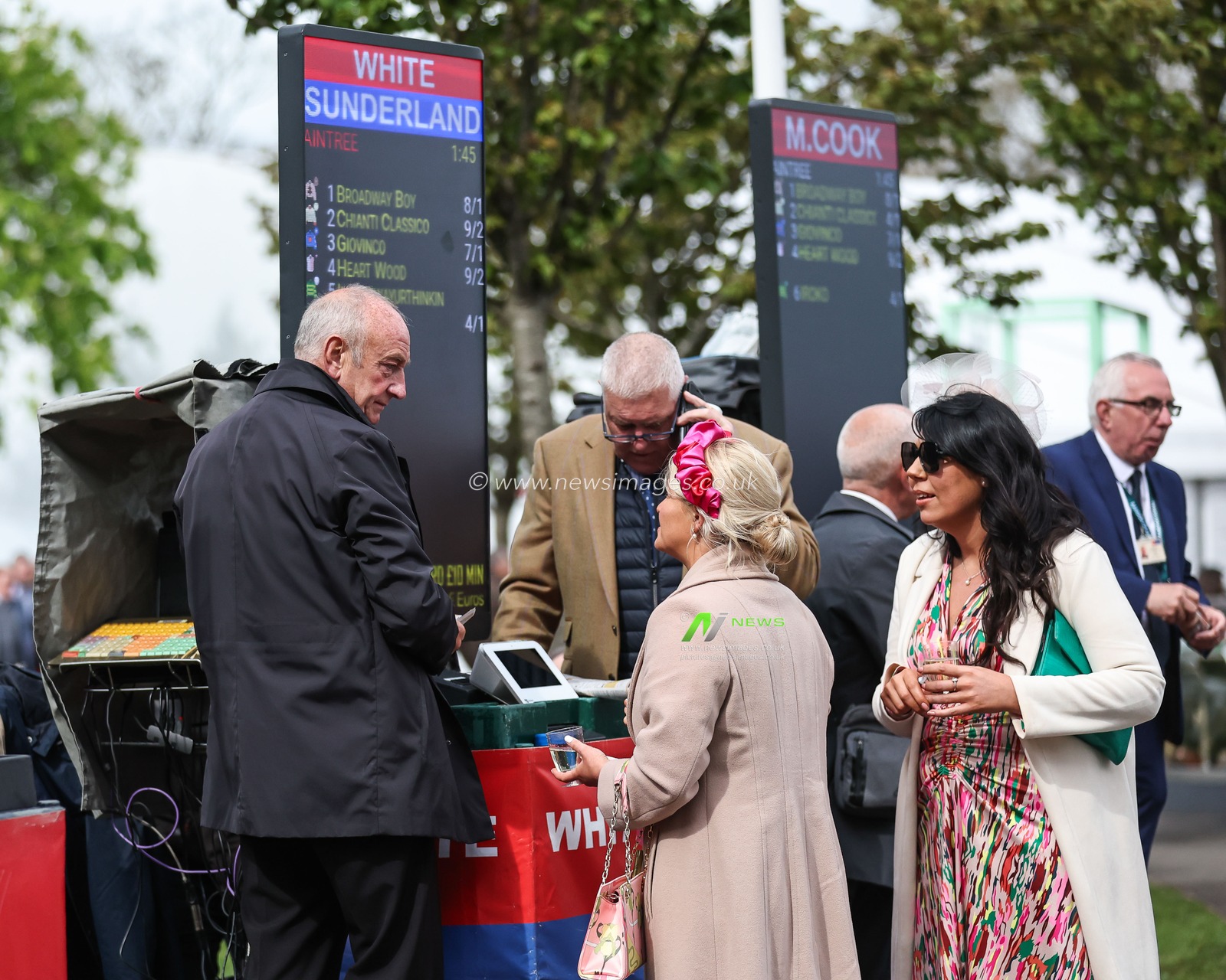 Racegoers placing bets during The Randox Grand National 2024 Ladies Day at Aintree Racecourse, Liverpool, United Kingdom, 12th April 2024

(Photo by Mark Cosgrove/News Images)
