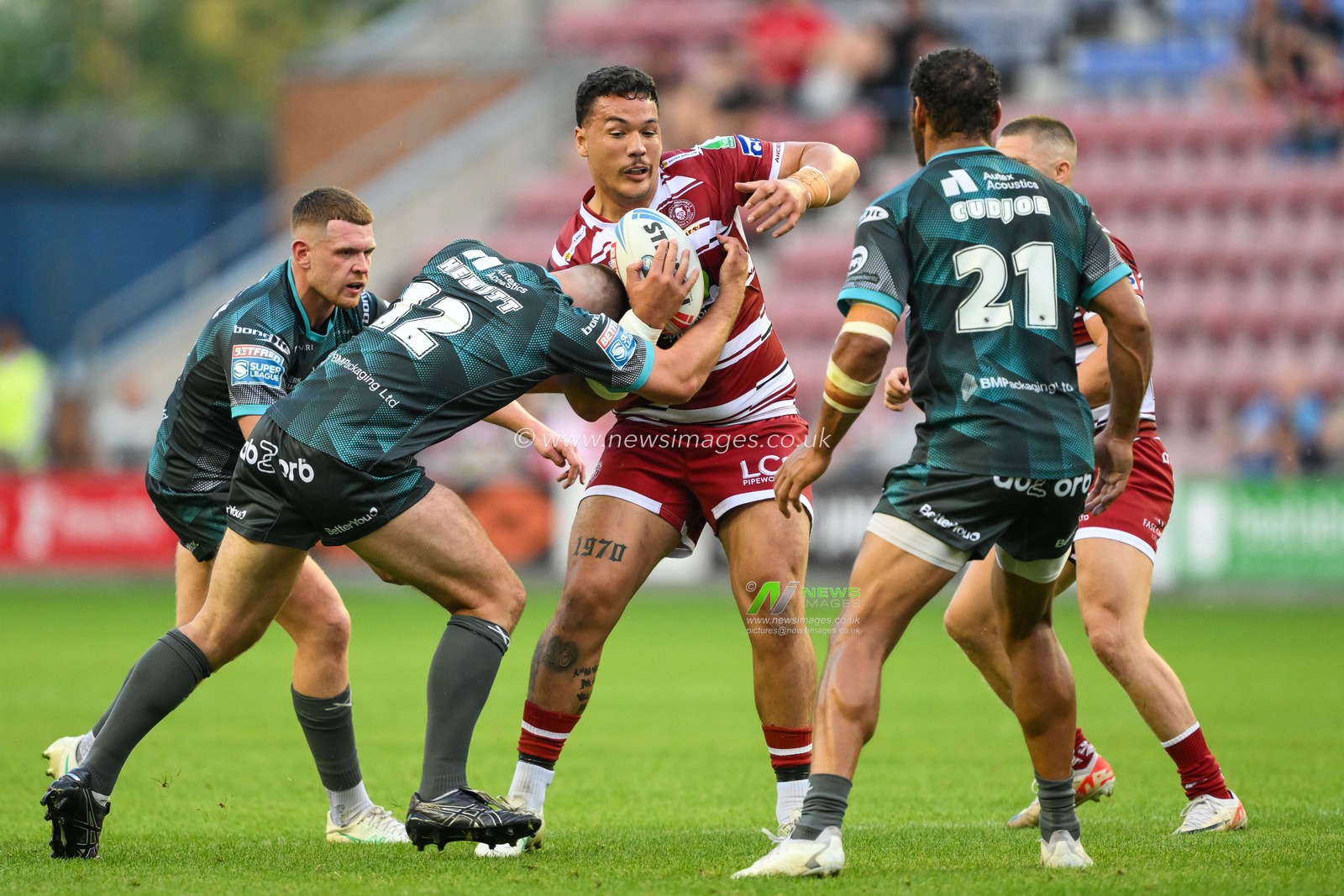 Tyler Dupree of Wigan Warriors is tackled by Sam Hewitt of Huddersfield Giants during the Betfred Super League Round 20 match Wigan Warriors vs Huddersfield Giants at DW Stadium, Wigan, United Kingdom, 1st August 2024

(Photo by Craig Thomas/News Images)