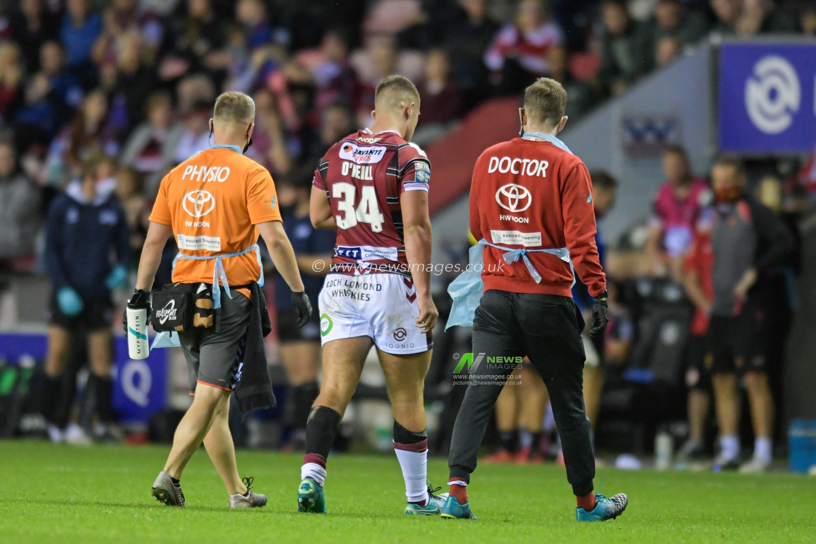 Brad Oâ€™Neill (34) of Wigan Warriors leaves the pitch for a head assessment