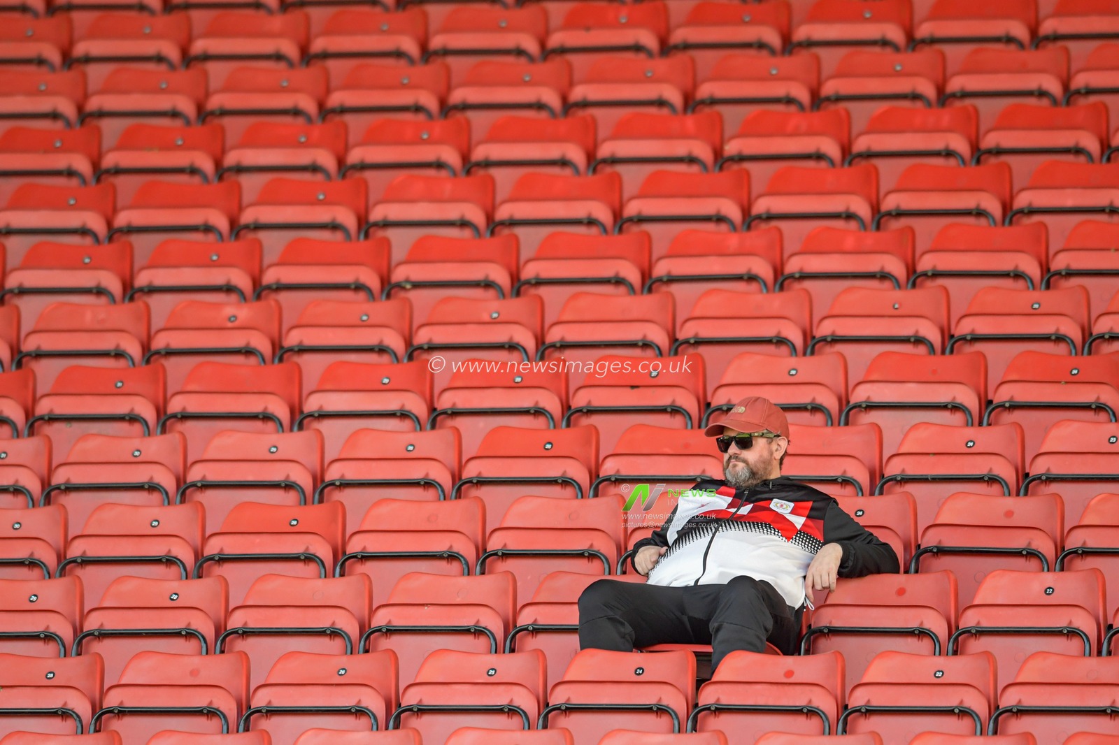 A Crewe Alexandra fan waits for kick off