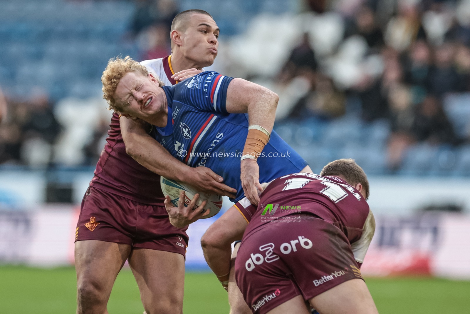 Lachlan Walmsley of Wakefield Trinity is tackled by Tui Lolohea of Huddersfield Giants and Asher O'Donnell of Huddersfield Giants during the Betfred Super League Round 2 match Huddersfield Giants vs Wakefield Trinity at Accu Stadium, Huddersfield, United Kingdom on 22 February 2026

(Photo by Mark Cosgrove/News Images)