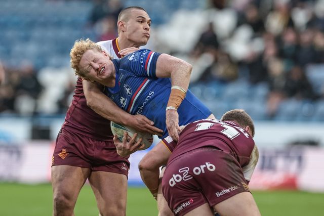 Lachlan Walmsley of Wakefield Trinity is tackled by Tui Lolohea of Huddersfield Giants and Asher O'Donnell of Huddersfield Giants during the Betfred Super League Round 2 match Huddersfield Giants vs Wakefield Trinity at Accu Stadium, Huddersfield, United Kingdom on 22 February 2026

(Photo by Mark Cosgrove/News Images)