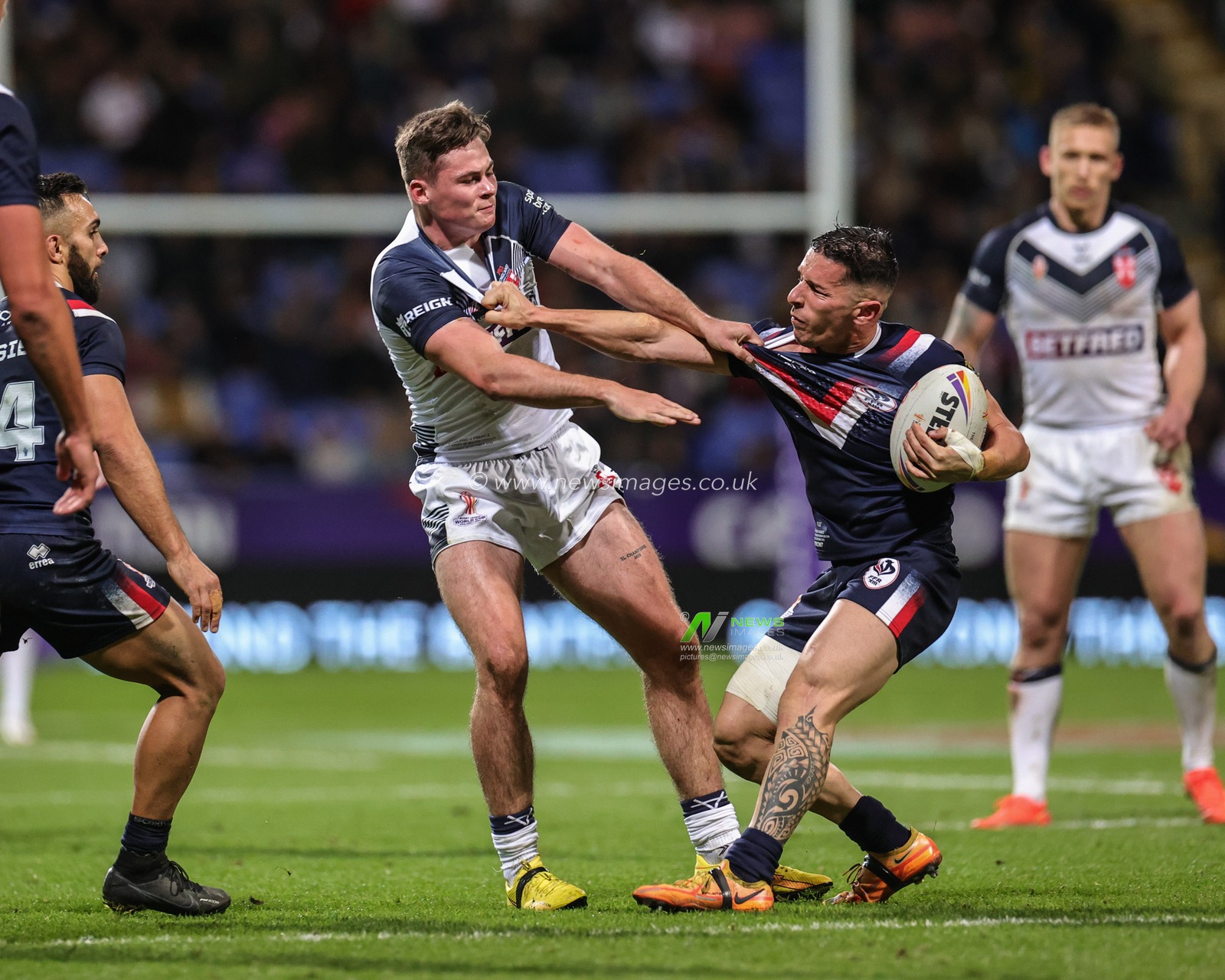 Jack Welsby of England and Morgan EscarÃ© of France tussle for the ball during the Rugby League World Cup 2021 Group A match England vs France at University of Bolton Stadium, Bolton, United Kingdom, 22nd October 2022

(Photo by Mark Cosgrove/News Images)