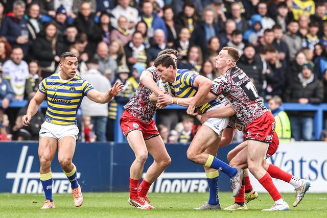 Sam Stone of Warrington Wolves is tackled by Frankie Halton of Leigh Leopards during the Betfred Super League round 7 match Warrington Wolves vs Leigh Leopards at The Halliwell Jones Stadium, Warrington, United Kingdom on 04 April 2026

(Photo by Alfie Cosgrove/News Images)
