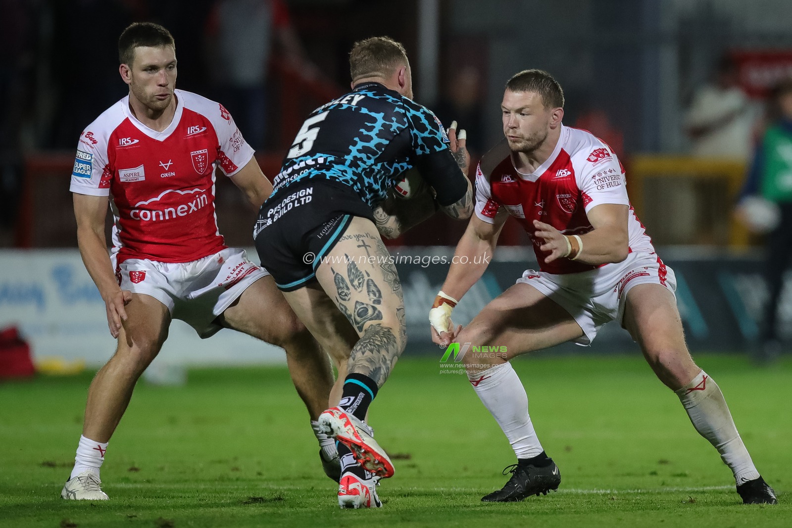 Josh Charnley #5 of Leigh Leopards is tackled by James Batchelor #16 of Hull KR during the Betfred Super League Round 23 match Hull KR vs Leigh Leopards at Sewell Group Craven Park, Kingston upon Hull, United Kingdom, 25th August 2023

(Photo by James Heaton/News Images)