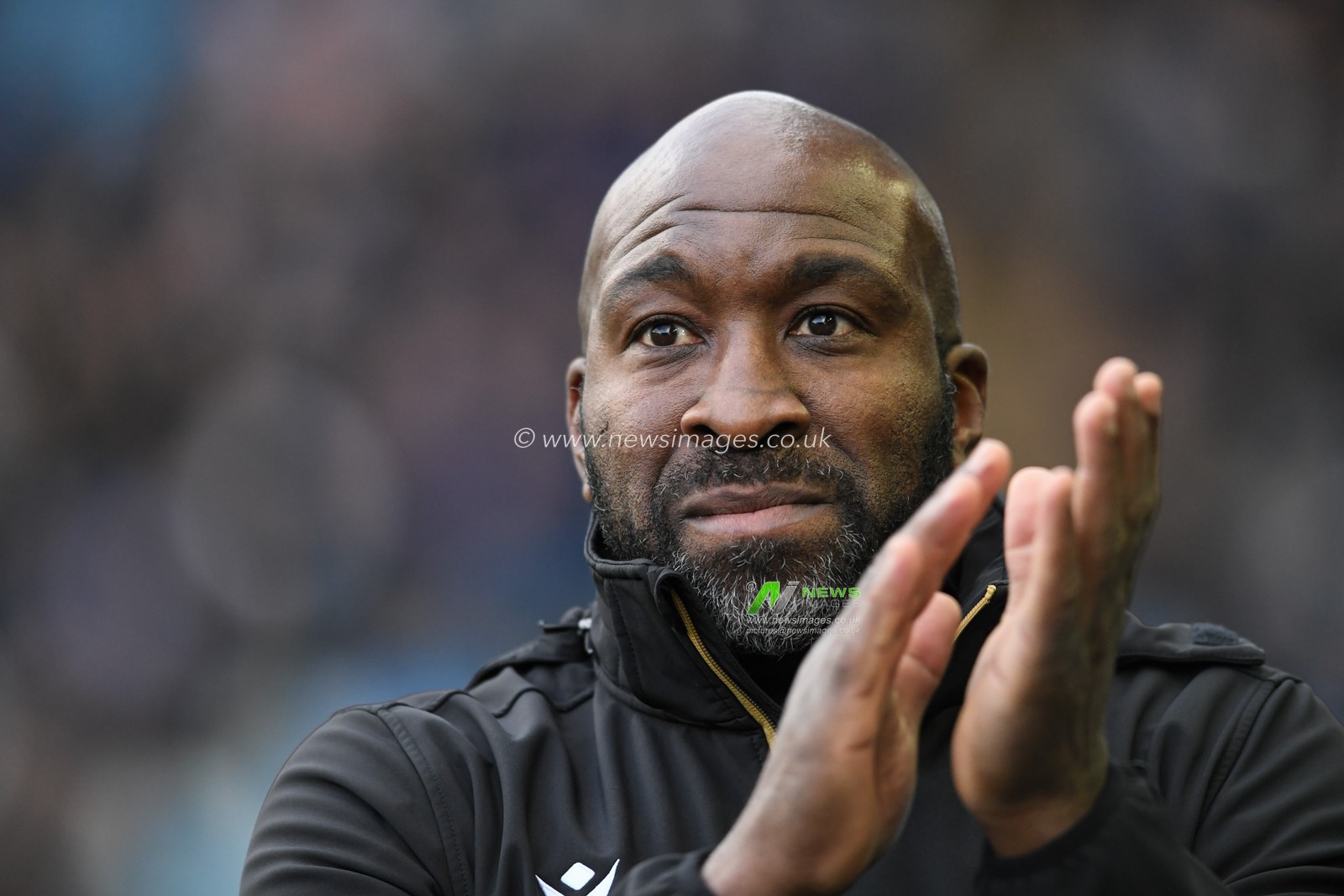 Darren Moore manager of Sheffield Wednesday applauds the home supporters before the game