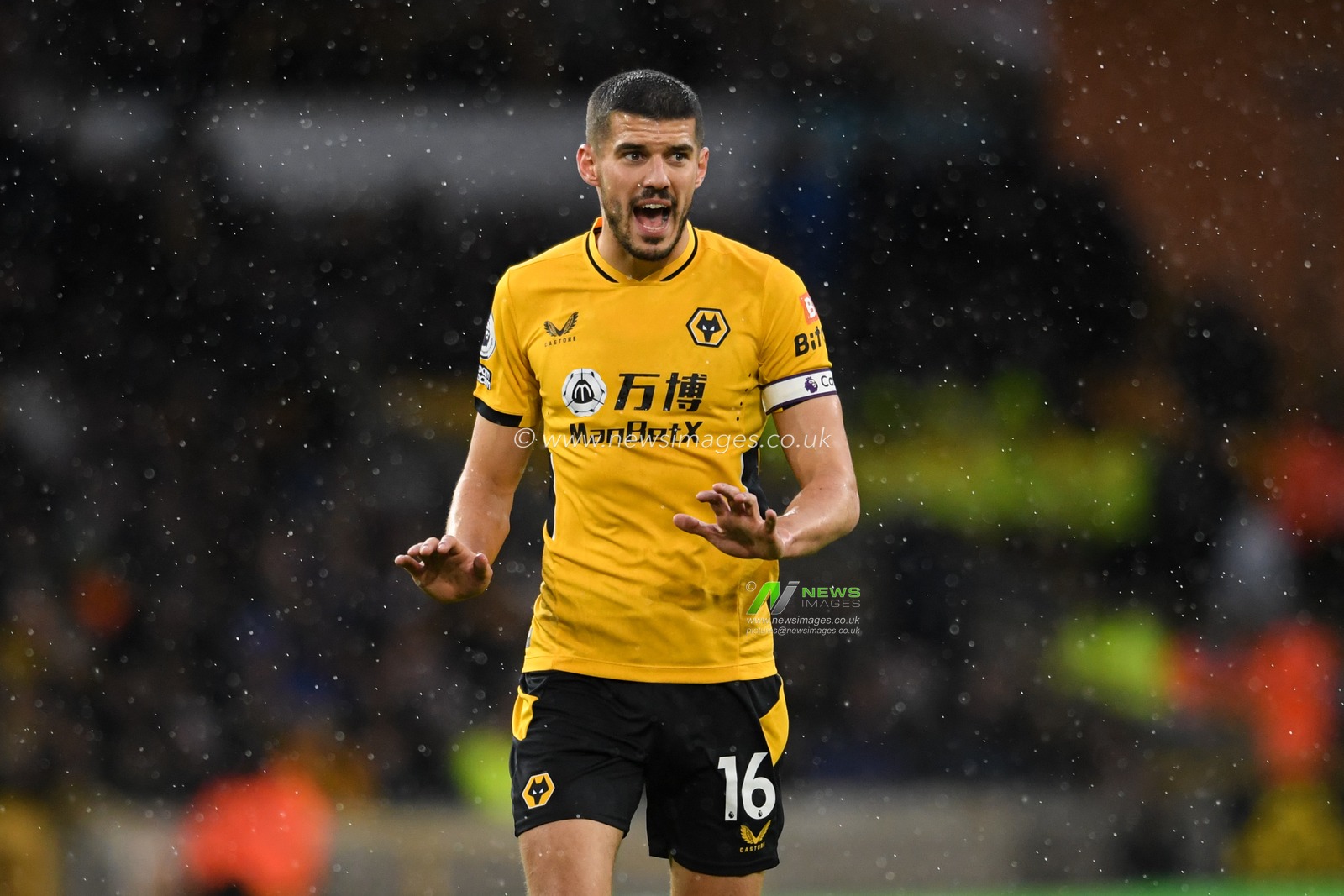Conor Coady #16 of Wolverhampton Wanderers appeals for calm during the game