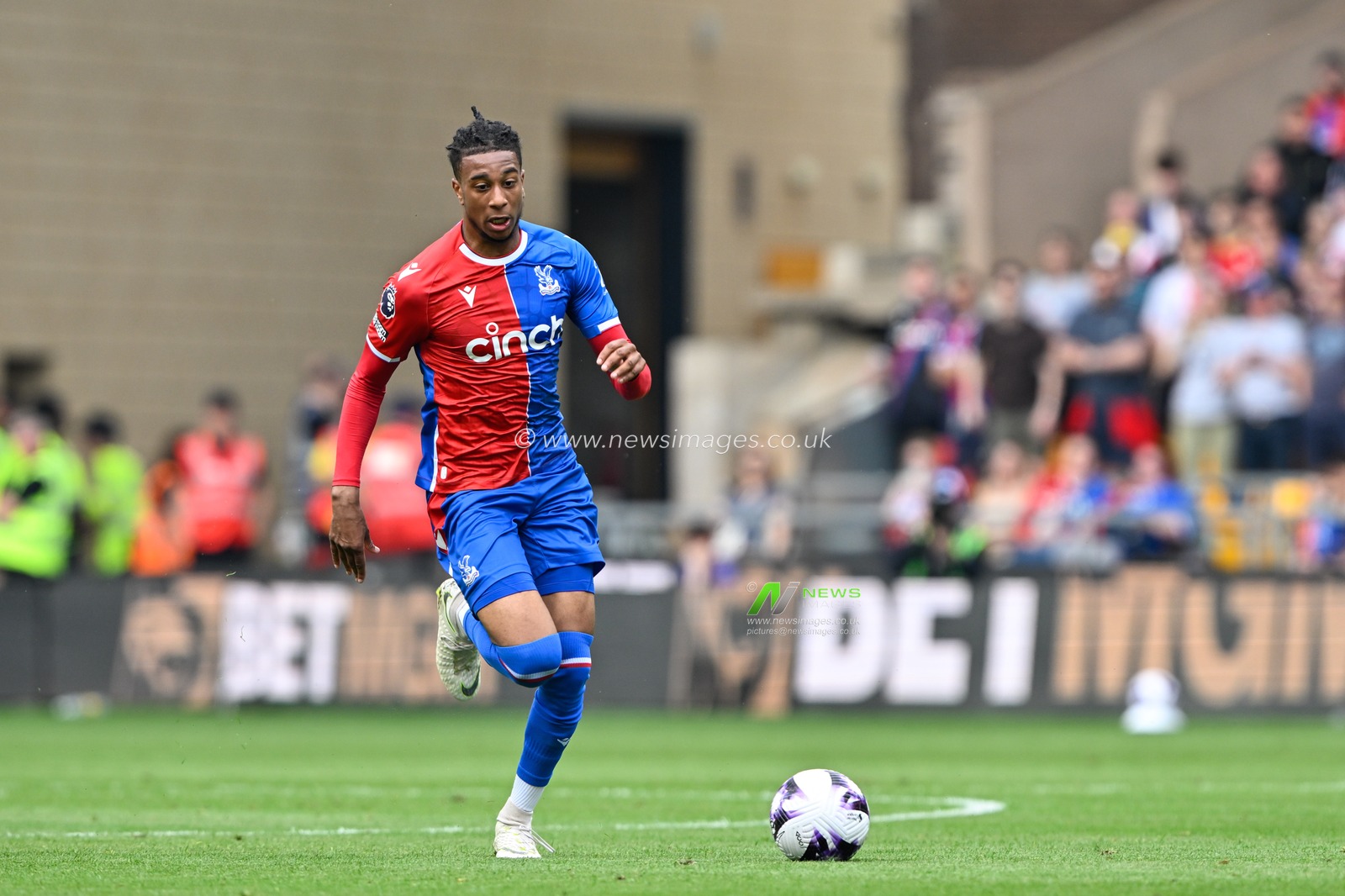 Michael Olise of Crystal Palace breaks forward with the ball, during the Premier League match Wolverhampton Wanderers vs Crystal Palace at Molineux, Wolverhampton, United Kingdom, 11th May 2024

(Photo by Cody Froggatt/News Images)