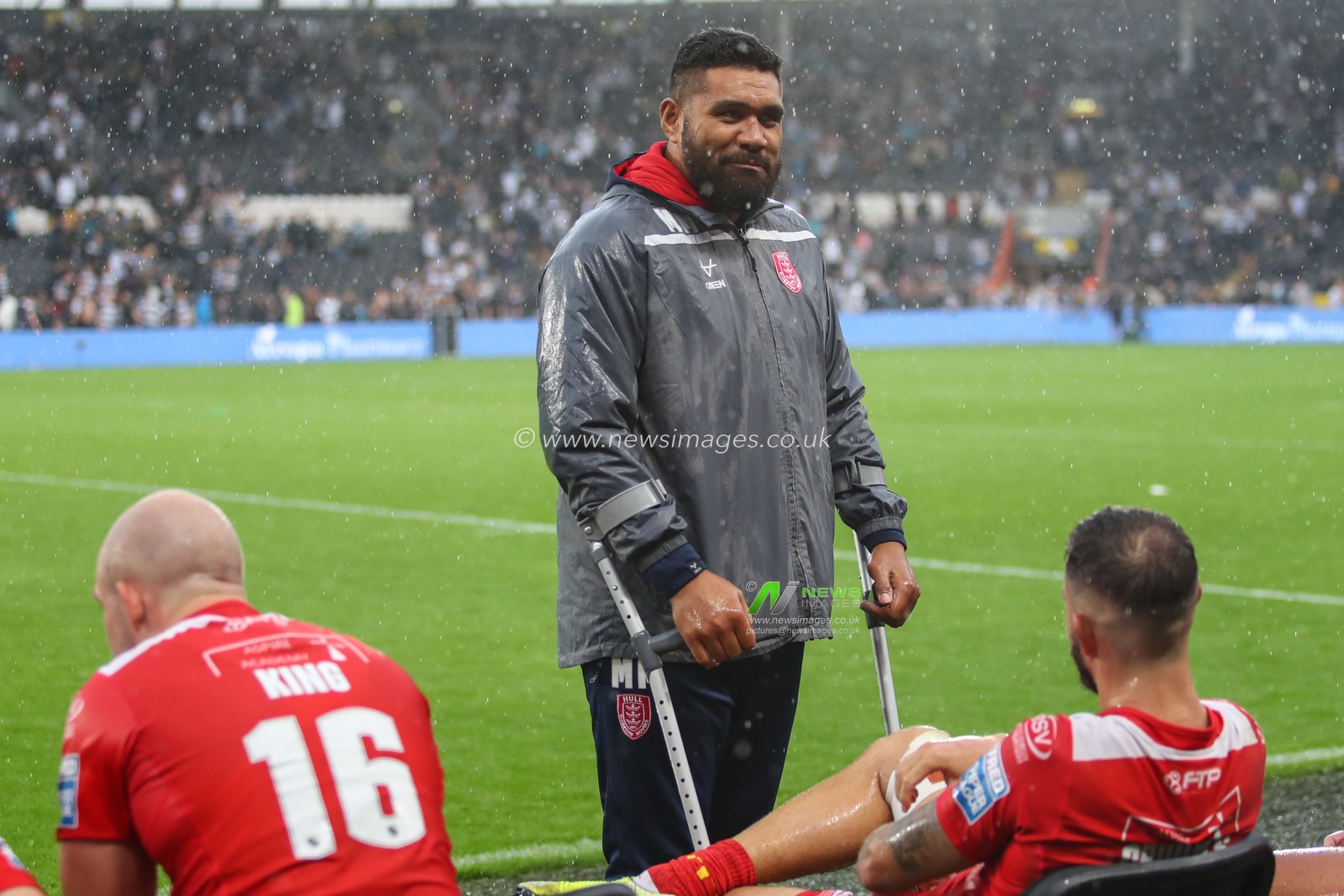 Mose Masoe speaks with Ben Crooks (2) of Hull KR after the final hooter
