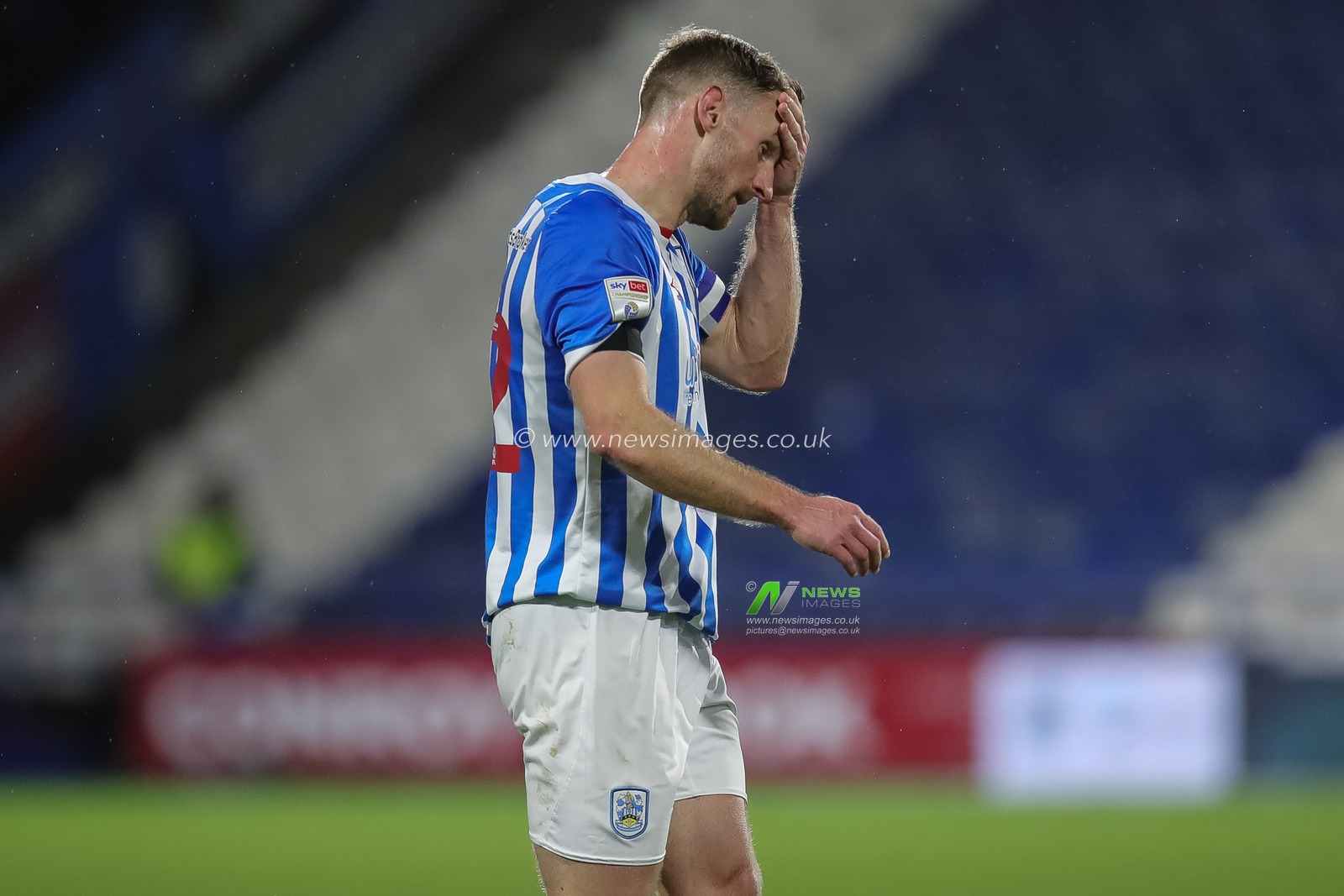 A dejected Tom Lees #32 of Huddersfield Town after the Sky Bet Championship match Huddersfield Town vs Luton Town at John Smith's Stadium, Huddersfield, United Kingdom, 1st January 2023

(Photo by James Heaton/News Images)