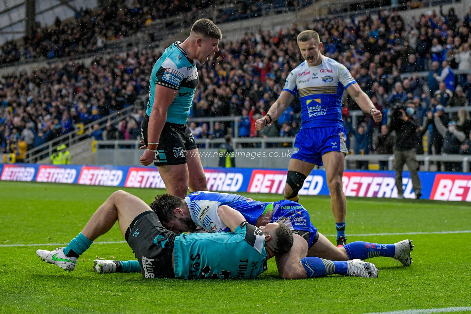 Carlos Tuimavave (3) of Hull FC prevents Tom Briscoe (2) of Leeds Rhinos from scoring a try