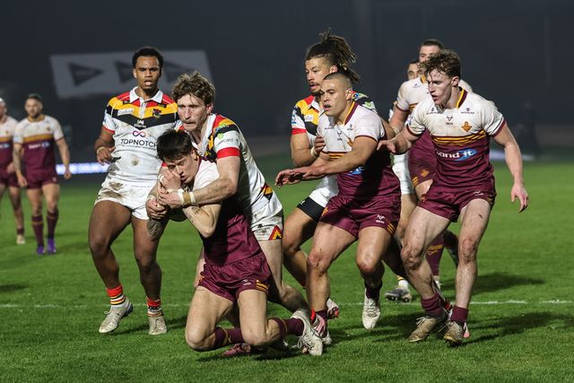 Riley Lumb of Huddersfield Giants is tackled by Ethan Ryan of Bradford Bulls during the Betfred Super League Round 5 match Bradford Bulls vs Huddersfield Giants at Odsal Stadium, Bradford, United Kingdom on 20 March 2026

(Photo by Mark Cosgrove/News Images)