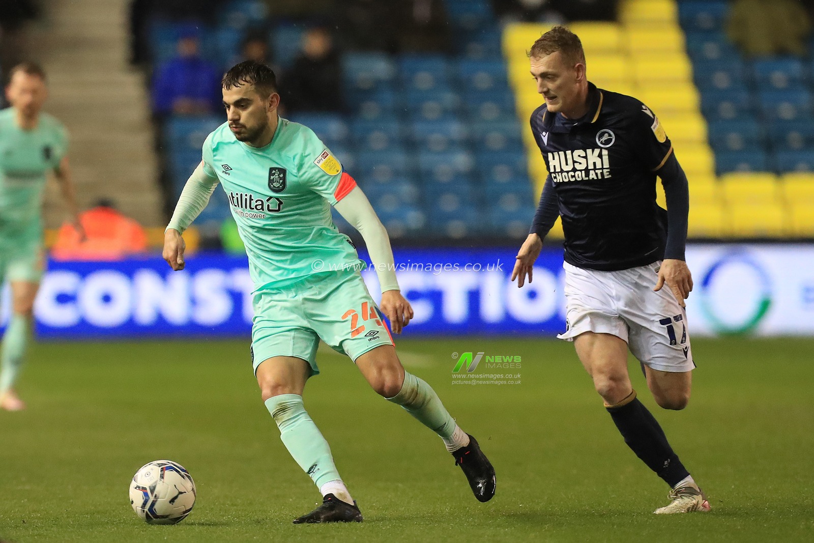Danel Sinani #24 of Huddersfield Town dribbling with the ball.