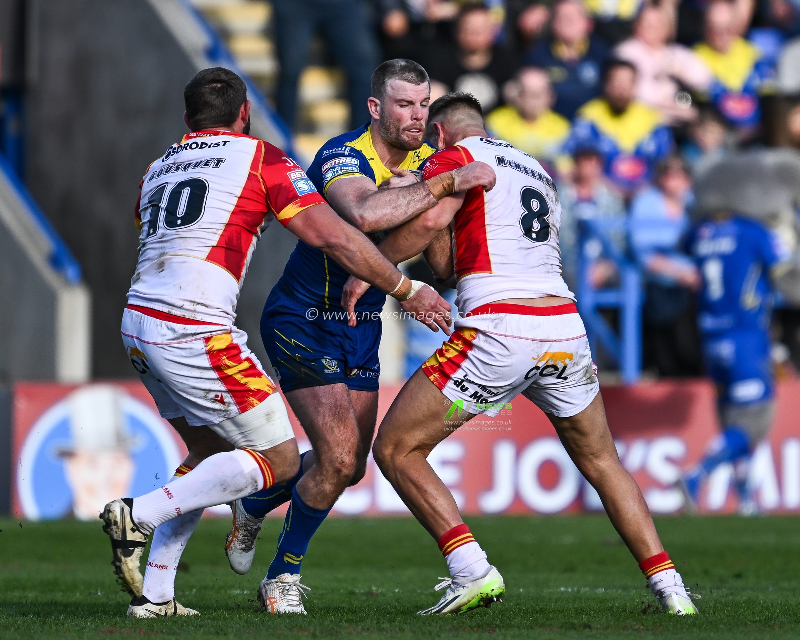 Lachlan Fitzgibbon of Warrington Wolves is tackled by Mike McMeeken of Catalan Dragons during the Betfred Super League match Warrington Wolves vs Catalans Dragons at Halliwell Jones Stadium, Warrington, United Kingdom, 30th March 2024

(Photo by Craig Thomas/News Images)