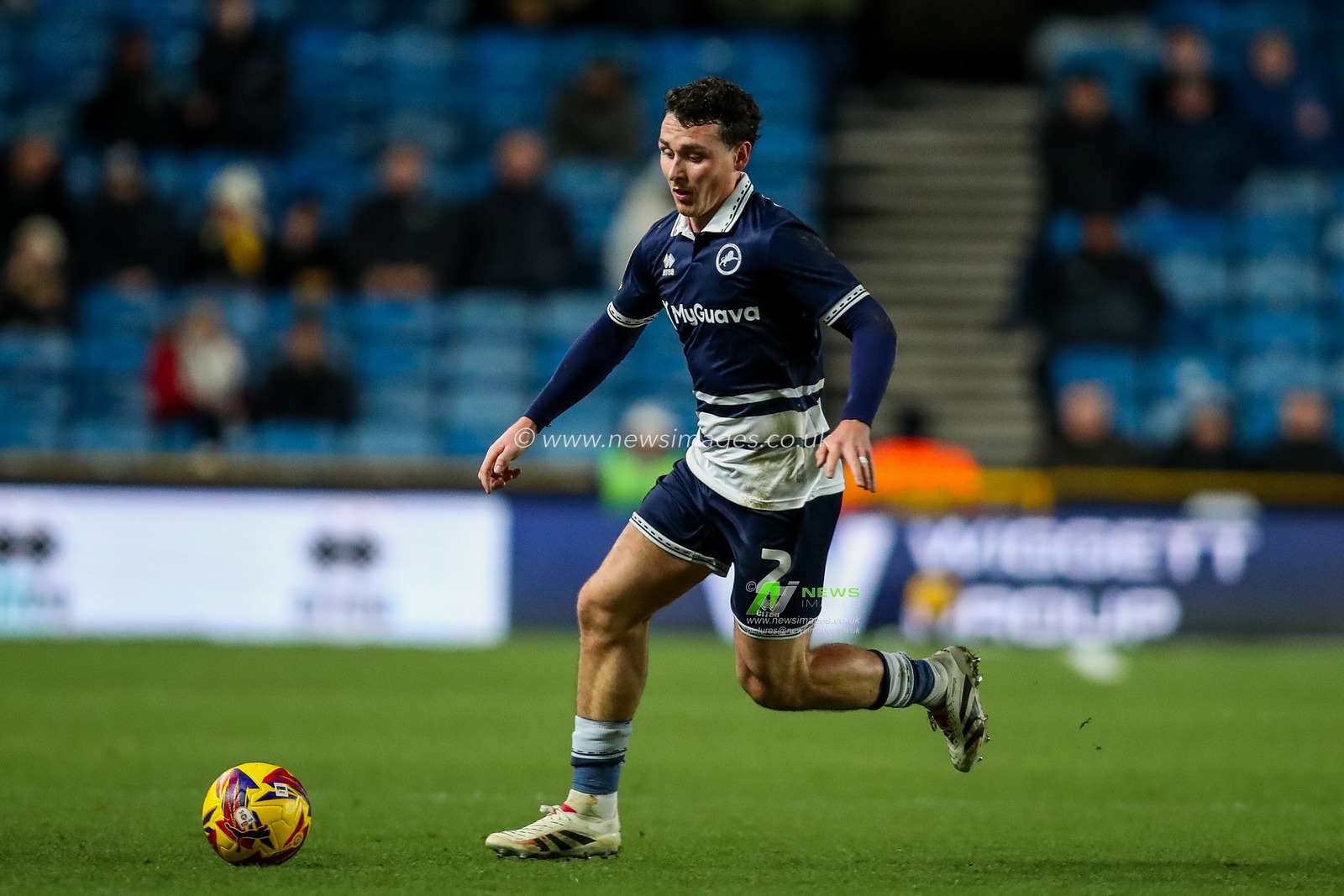 Dan McNamara of Millwall runs with the ball during the Sky Bet Championship match Millwall vs Sheffield United at The Den, London, United Kingdom, 11th December 2024

(Photo by Izzy Poles/News Images)