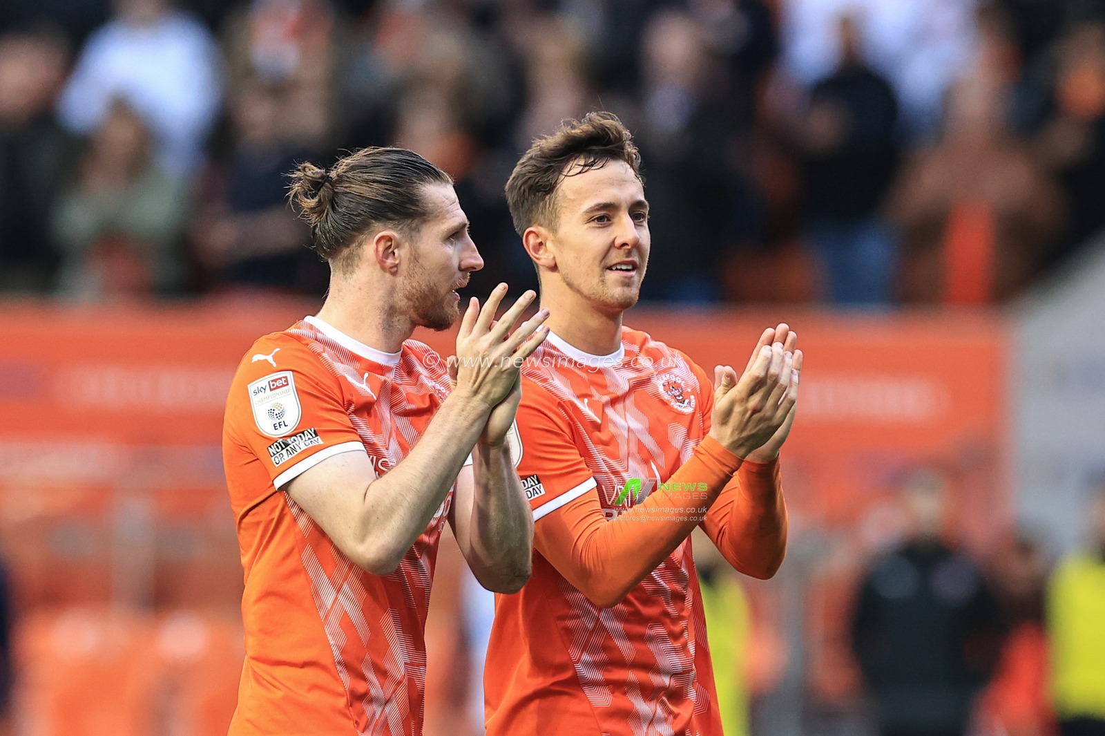 James Husband #3 of Blackpool and Ryan Wintle #8 of Blackpool celebrate Blackpoolâ€™s 2-0 win over Preston
