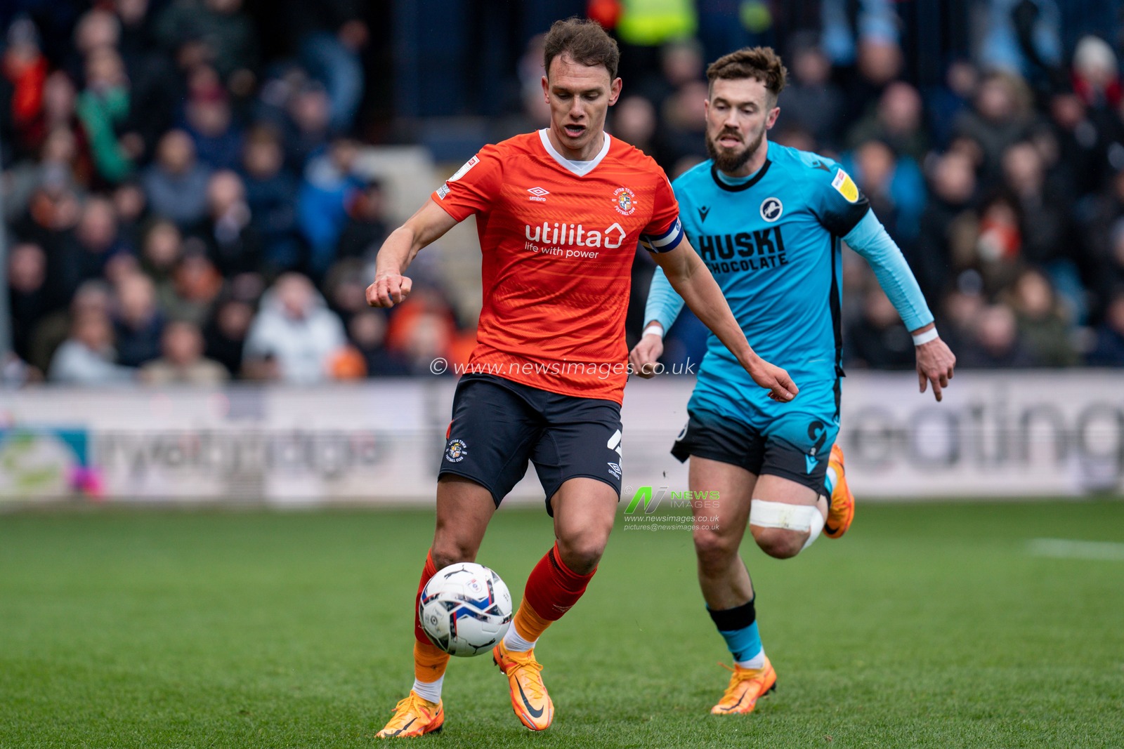 Kal Naismith #4 of Luton Town battles with Tom Bradshaw #9 of Millwall