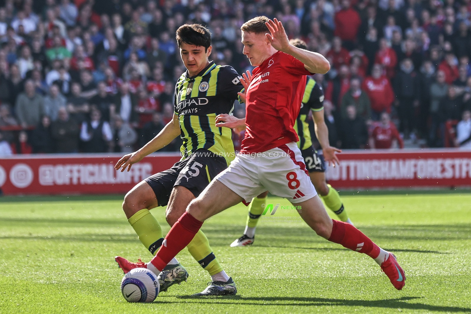 Elliot Anderson of Nottingham Forest and Abdukodir Khusanov of Manchester City battle for the ball during the Premier League match Nottingham Forest vs Manchester City at City Ground, Nottingham, United Kingdom, 8th March 2025

(Photo by Alfie Cosgrove/News Images)