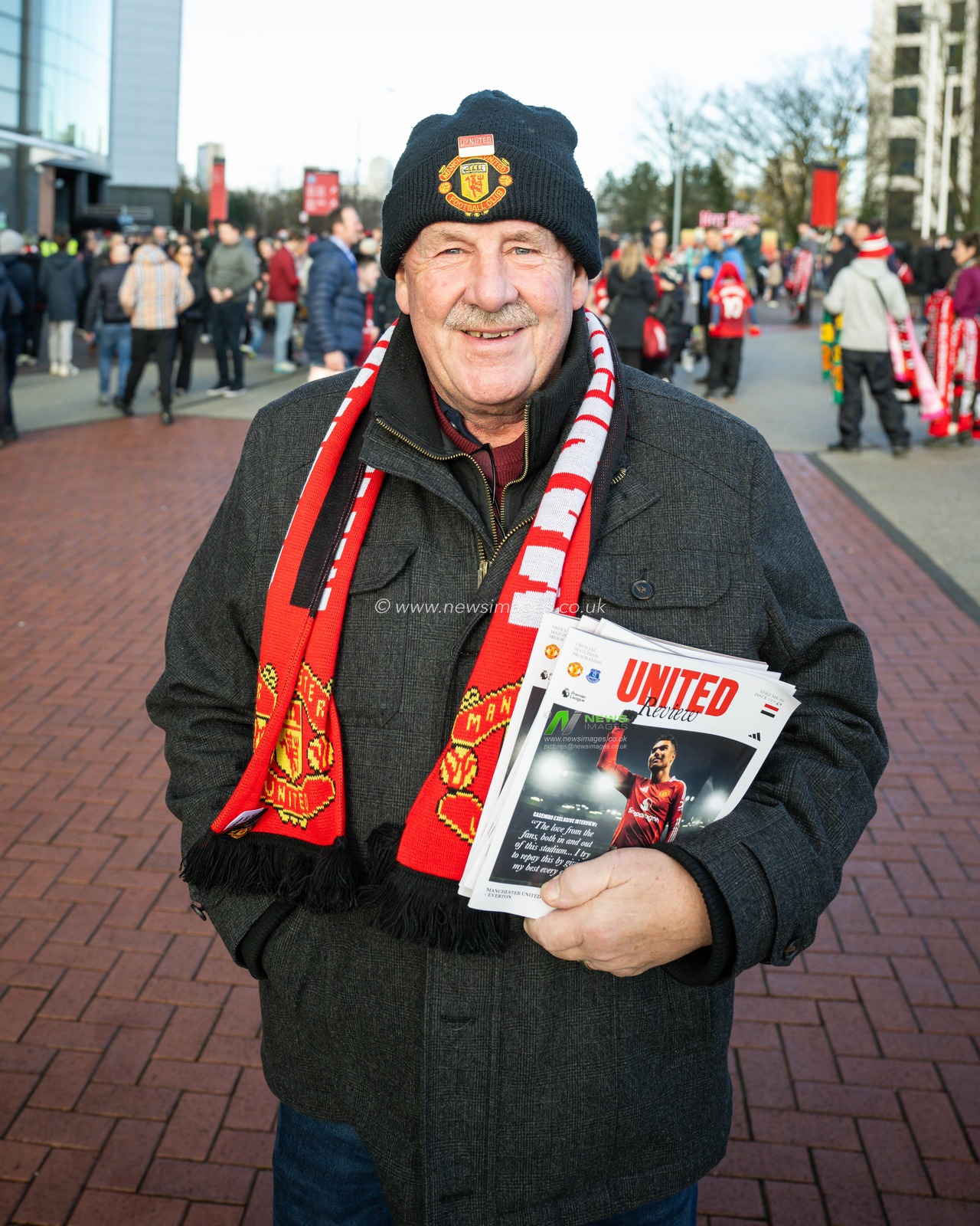 A fan arrives ahead of the Premier League match Manchester United vs Everton at Old Trafford, Manchester, United Kingdom, 1st December 2024

(Photo by Craig Thomas/News Images)