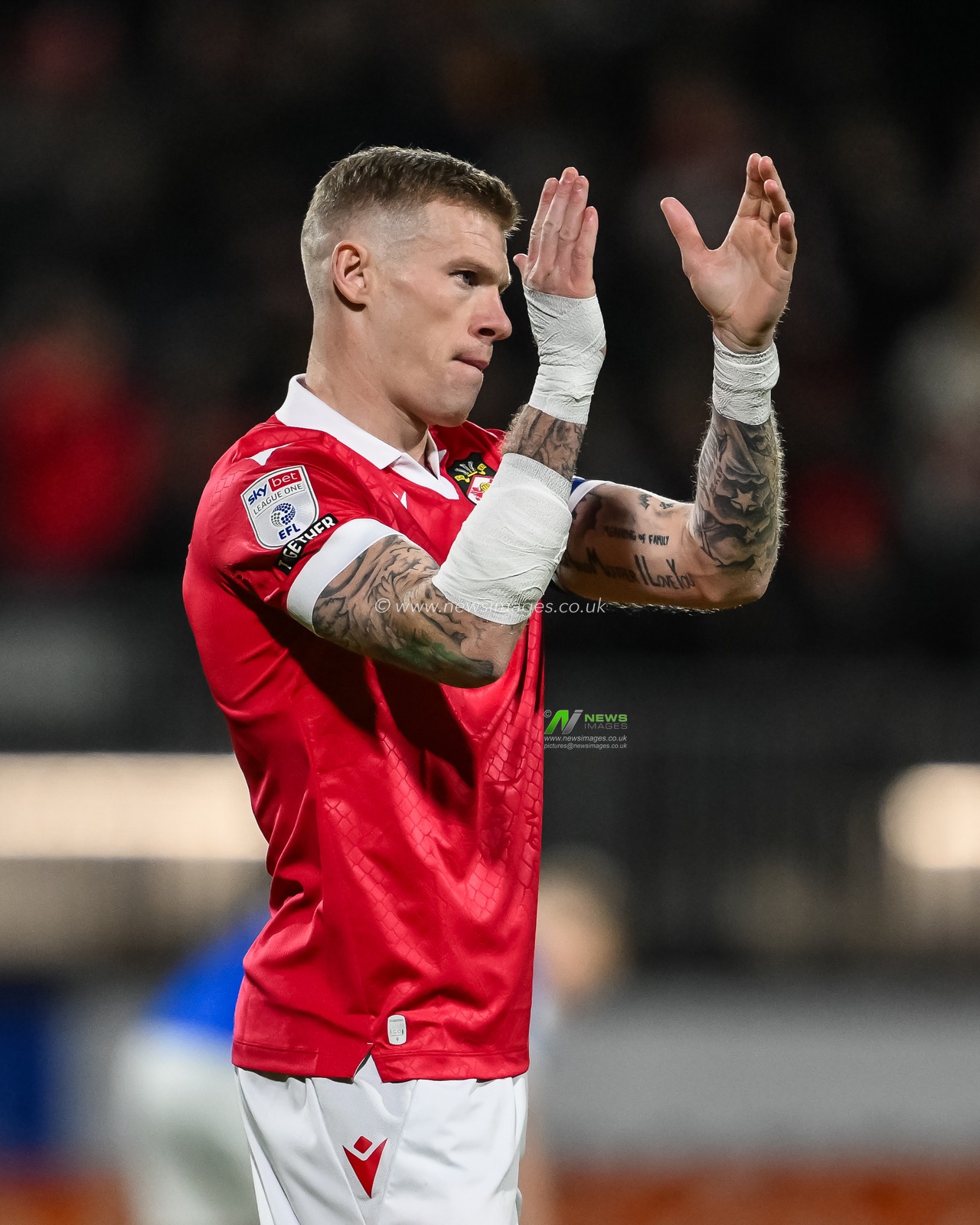 James McClean of Wrexham applauds the fans ahead box kick off with his arm and hands bandaged from the car crash he was in yesterday during the Sky Bet League 1 match Wrexham vs Birmingham City at SToK Cae Ras, Wrexham, United Kingdom, 23rd January 2025

(Photo by Craig Thomas/News Images)