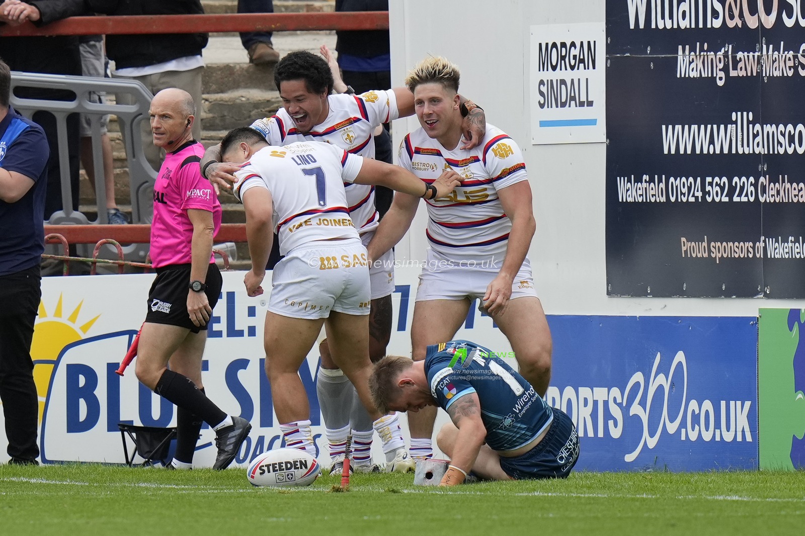 Trinity players celebrate with try scorer Tom Lineham #5 of Wakefield Trinity during the Betfred Super League Round 20 match Wakefield Trinity vs Warrington Wolves at The Be Well Support Stadium, Wakefield, United Kingdom, 30th July 2023

(Photo by Steve Flynn/News Images)