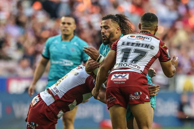 Ashton Golding of Huddersfield Giants is tackled during the Betfred Super League round 18 match Wigan Warriors vs Huddersfield Giants at The Brick Community Stadium, Wigan, United Kingdom, 11th July 2025

(Photo by Alfie Cosgrove/News Images)