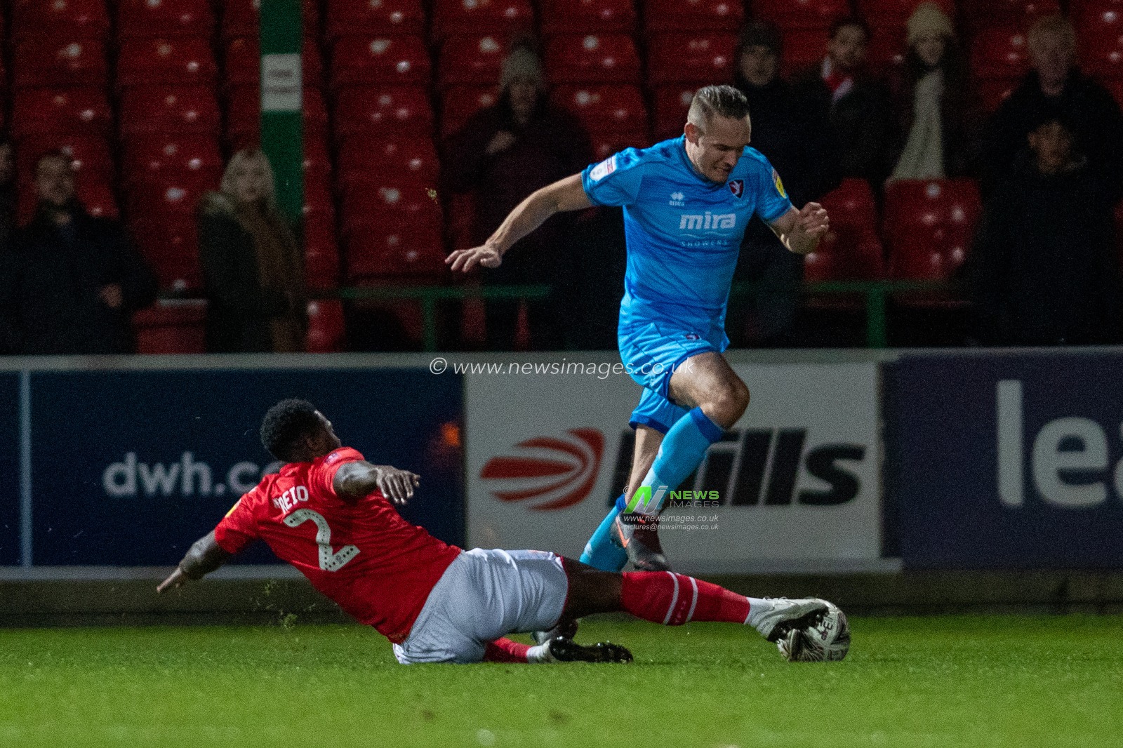 19th November 2019, County Ground, Swindon, England; Emirates FA Cup, First Round Replay, Swindon Town v Cheltenham Town : Tyler Reid of Swindon Town slides and wins the ball

Credit: Gareth Dalley/News Images