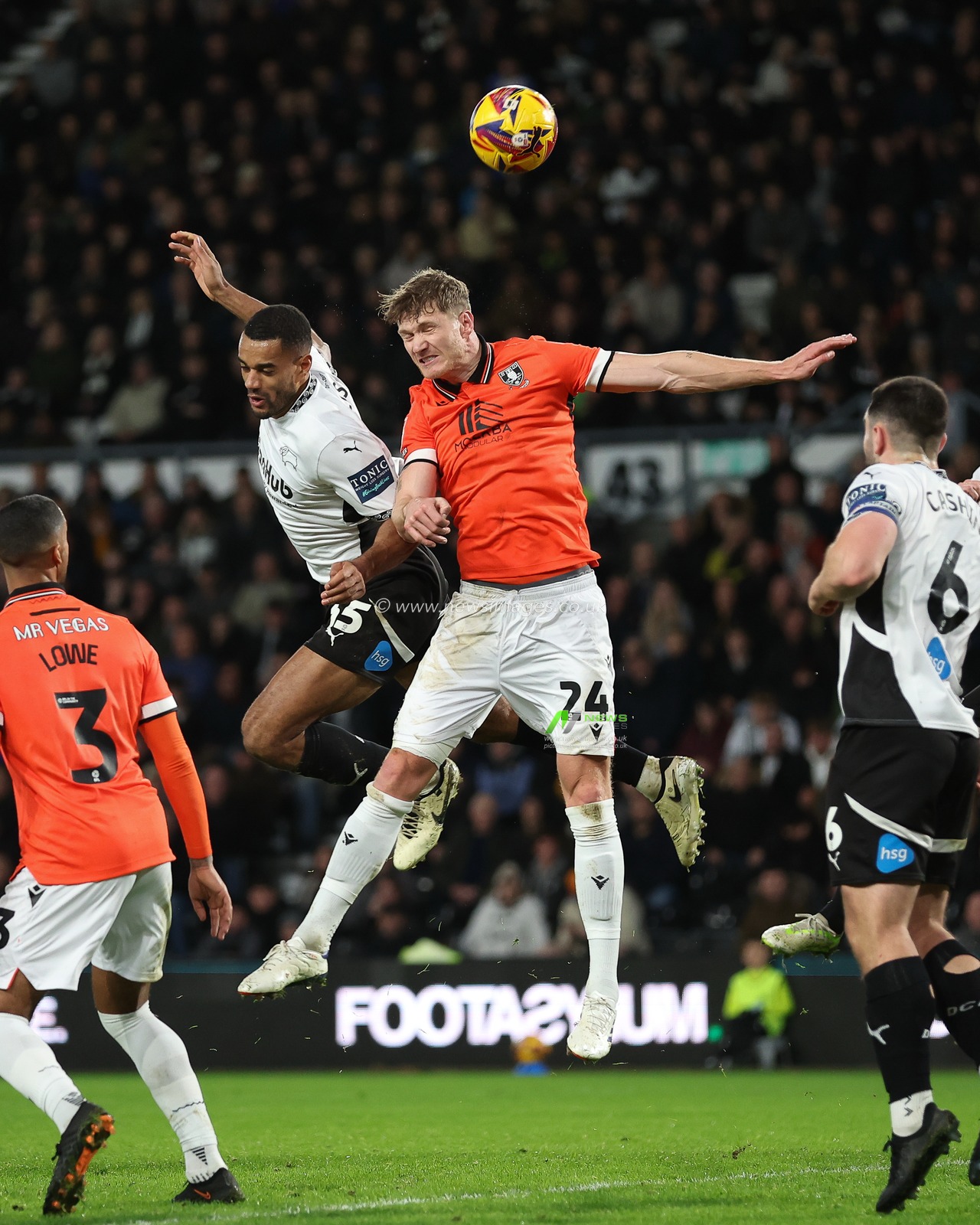 Curtis Nelson of Derby County and Michael Smith of Sheffield Wednesday challenge in the air during the Sky Bet Championship match Derby County vs Sheffield Wednesday at Pride Park Stadium, Derby, United Kingdom, 1st December 2024

(Photo by Alex Roebuck/News Images)
