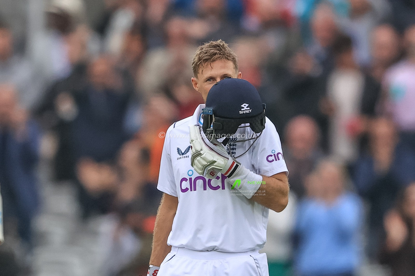 Joe Root of England kisses hit helmet as he celebrates his century as well as 10,000 test career runs