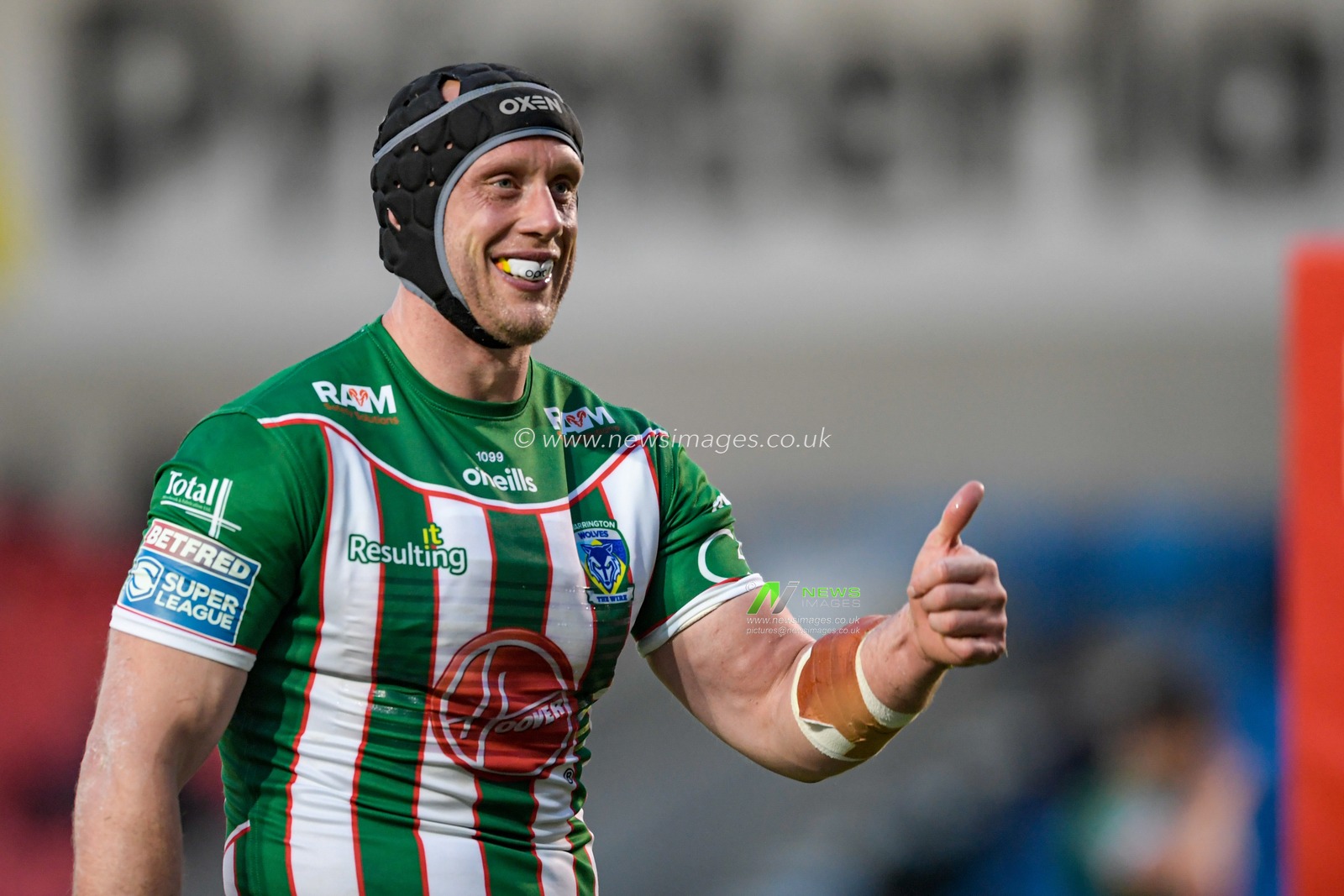 Chris Hill (8) of Warrington Wolves gives a thumbs up during the game