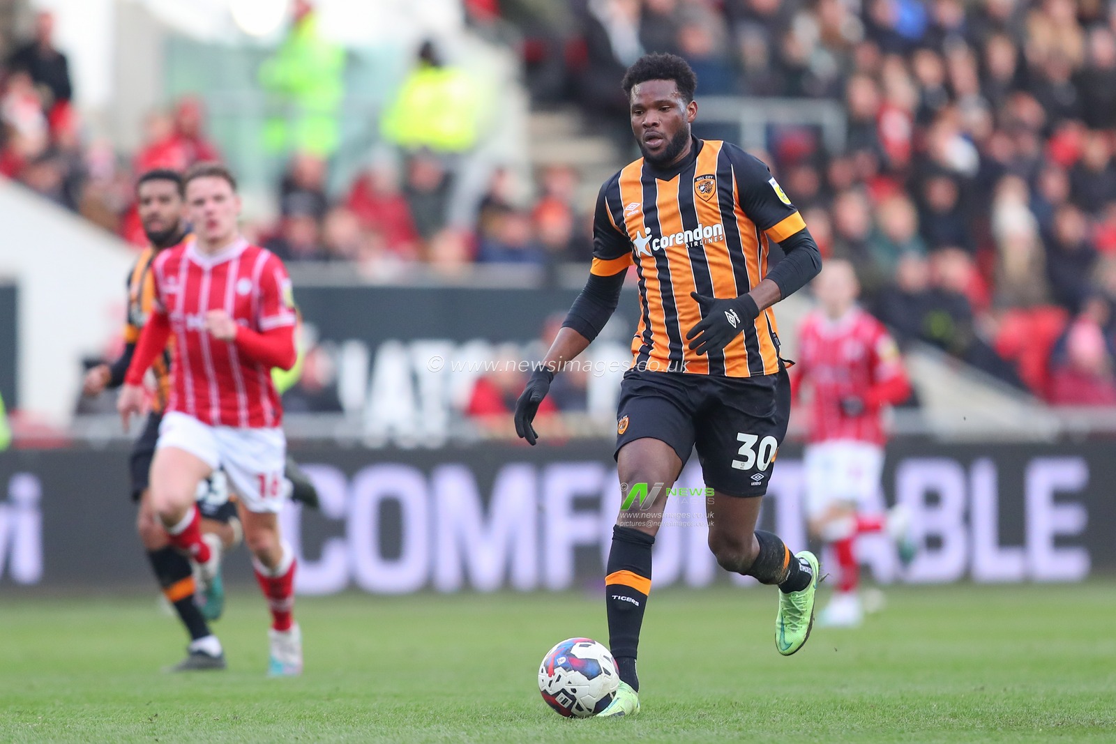Benjamin Tetteh #30 of Hull City runs with the ball during the Sky Bet Championship match Bristol City vs Hull City at Ashton Gate, Bristol, United Kingdom, 25th February 2023

(Photo by Gareth Evans/News Images)
