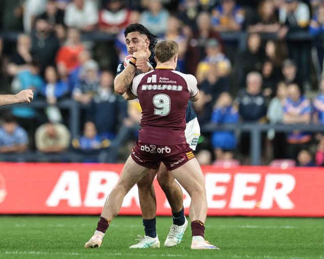 Keenan Palasia of Leeds Rhinos is tackled by Zac Woolford of Huddersfield Giants during the Betfred Super League round 12 match Leeds Rhinos vs Huddersfield Giants at AMT Headingley Stadium, Leeds, United Kingdom on 22 May 2026

(Photo by Mark Cosgrove/News Images)
