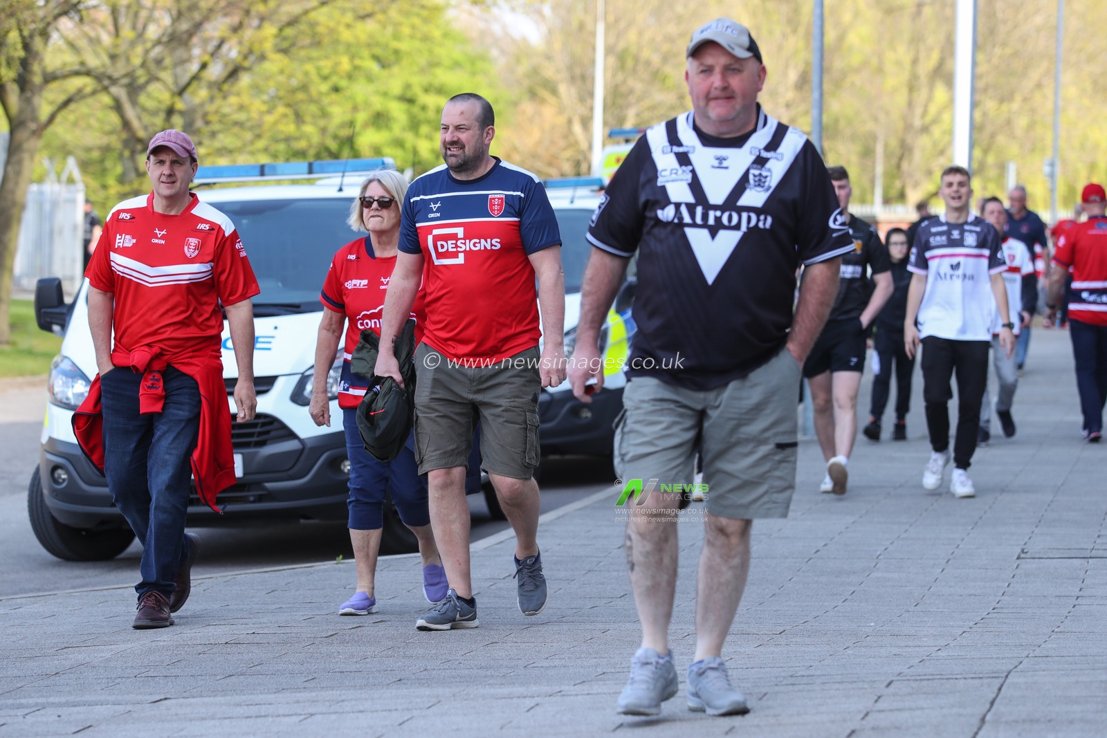 Hull KR fans and Hull FC walk side by side towards Sewell Group Craven Park