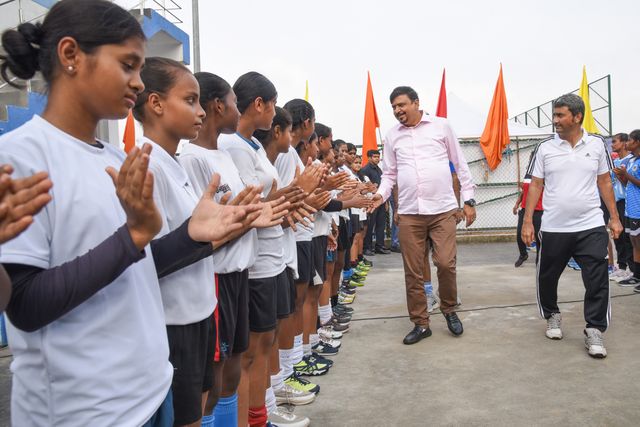 Sujit Bose, West Bengal State Fire Minister and President of Hockey Bengal, shakes hands with junior hockey players  at the celebration of World Olympic Day in Howrah, West Bengal ,India on June 22, 2025. Photo by Debajyoti Chakraborty.(Photo: Debajyoti Chakraborty/News Images)