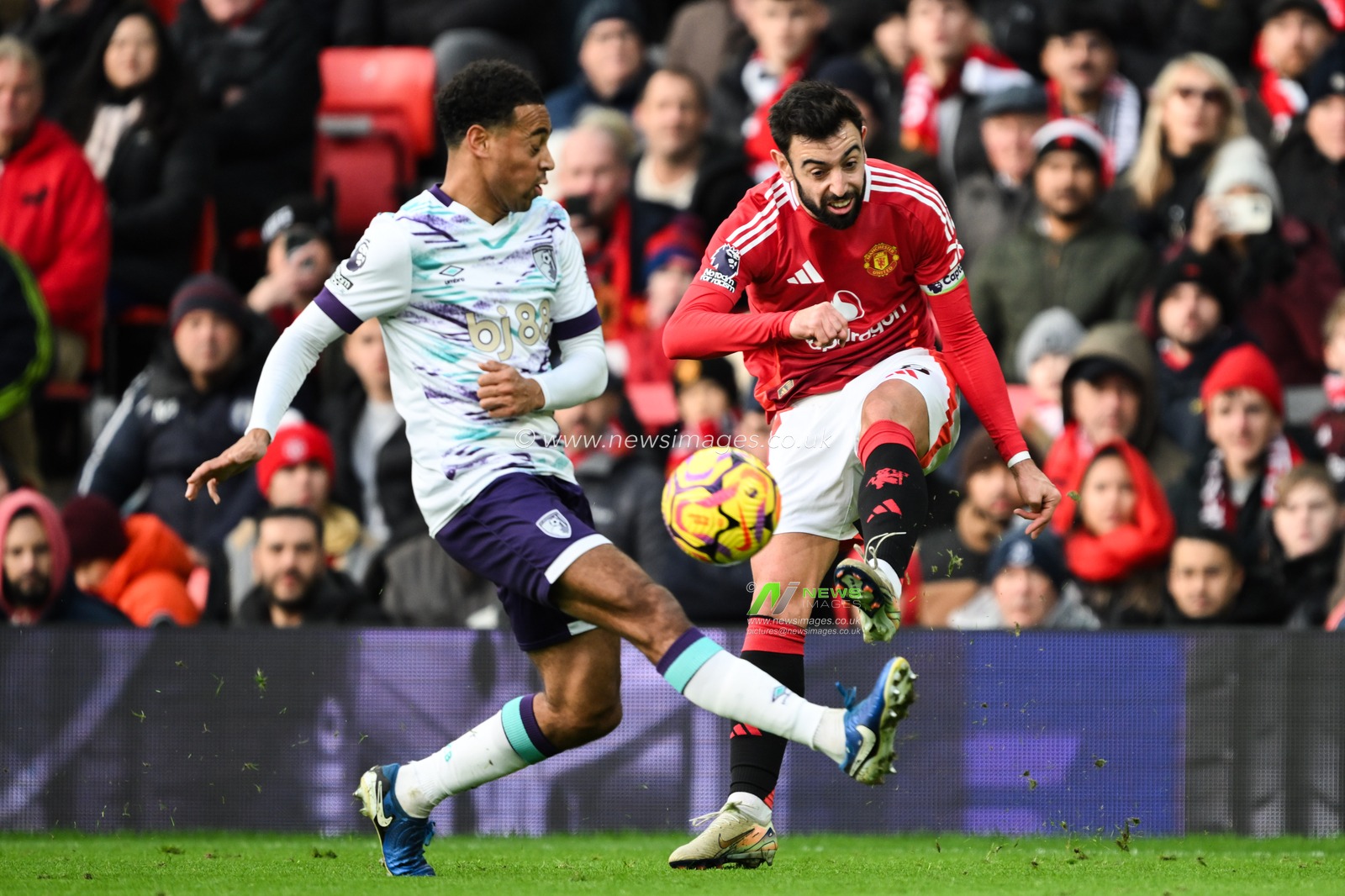 Bruno Fernandes of Manchester United crosses the ball whilst getting pressured by Tyler Adams of Bournemouth during the Premier League match Manchester United vs Bournemouth at Old Trafford, Manchester, United Kingdom, 22nd December 2024

(Photo by Craig Thomas/News Images)