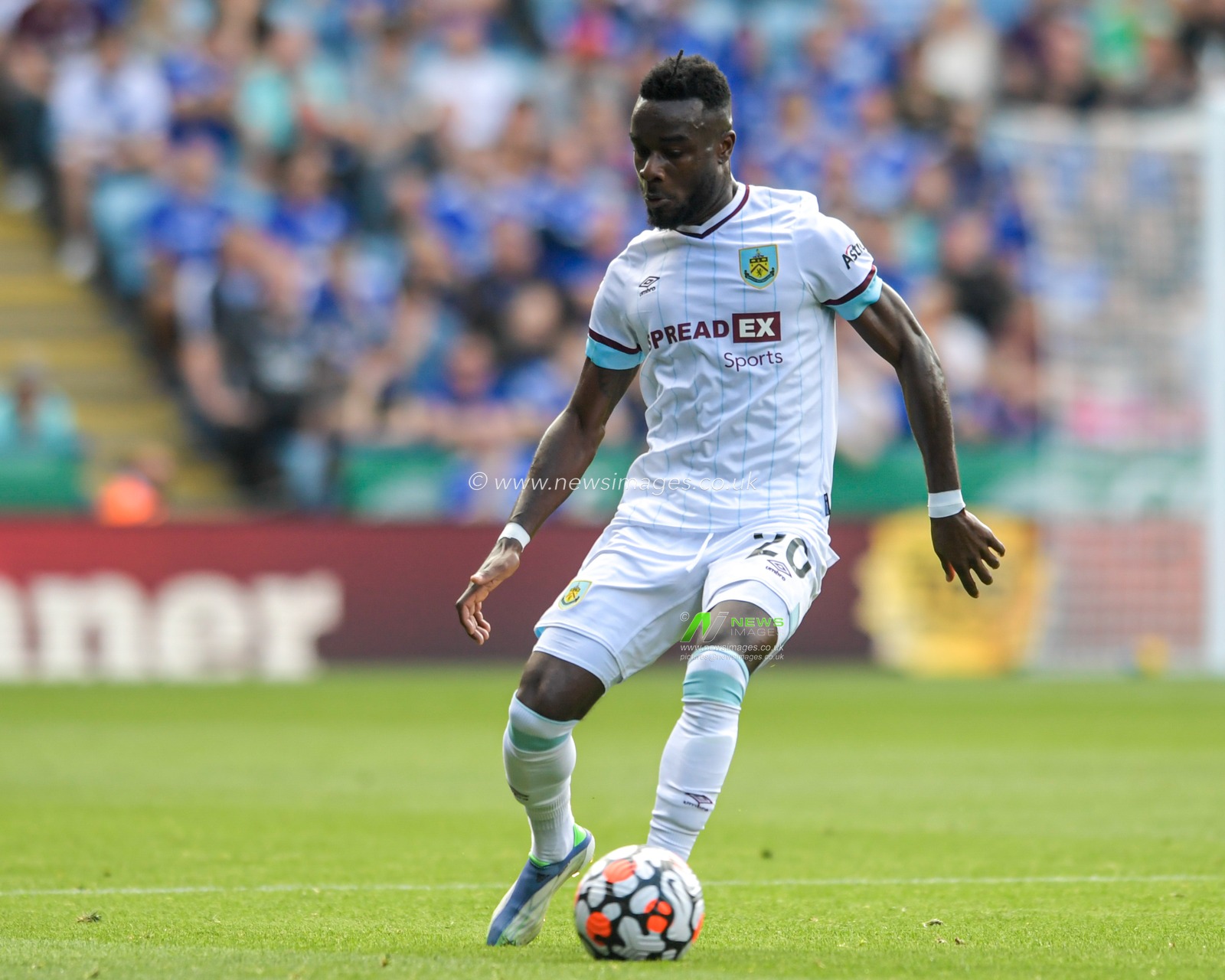 Maxwel Cornet #20 of Burnley with the ball