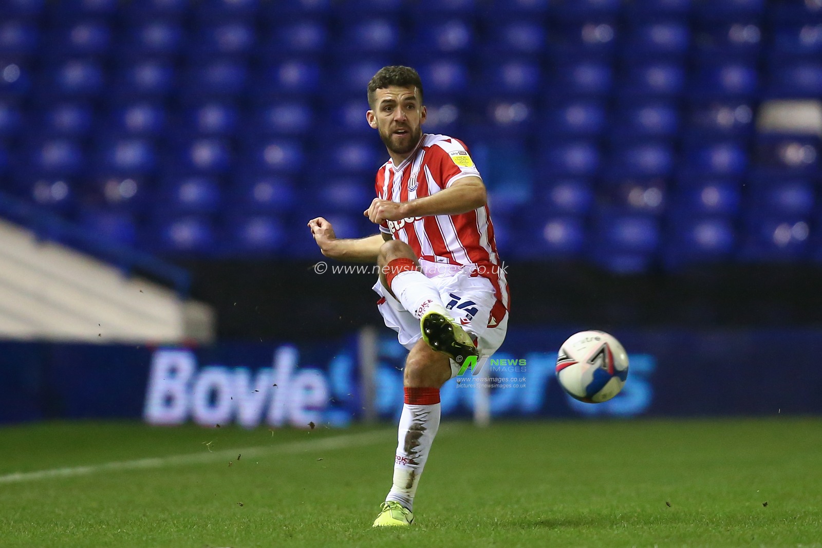 Tommy Smith #14 of Stoke City passes the ball