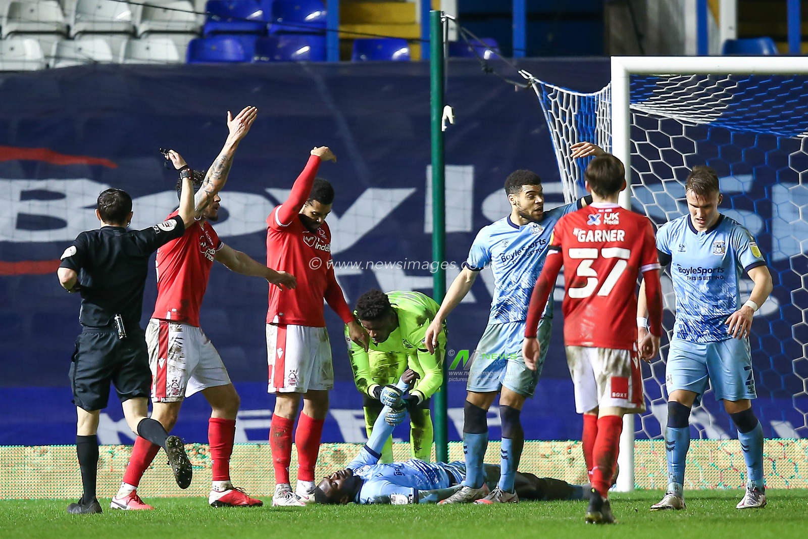 Amadou Bakayoko #20 of Coventry City is knocked unconscious following a challenge in the penalty area