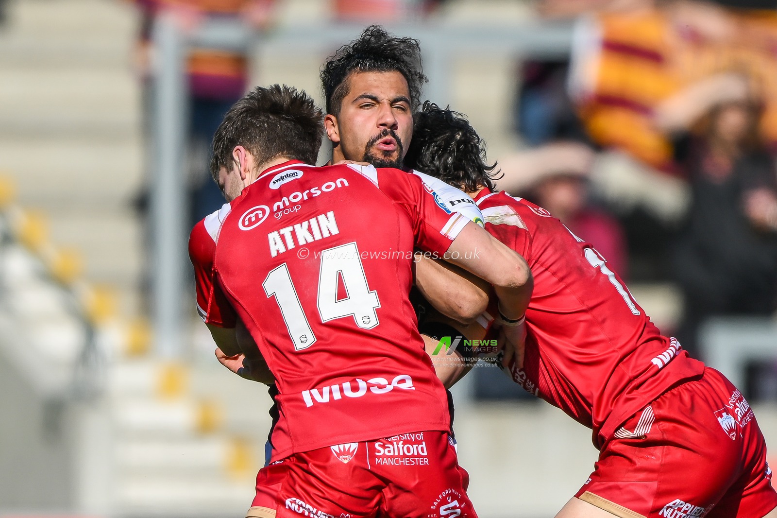 Ashton Golding #14 of Huddersfield Giants is tackled by Chris Atkin #14 and Shane Wright #17 of Salford Red Devils  during the Betfred Super League Round 7 match Salford Red Devils vs Huddersfield Giants at AJ Bell Stadium, Eccles, United Kingdom, 2nd April 2023

(Photo by Craig Thomas/News Images)
