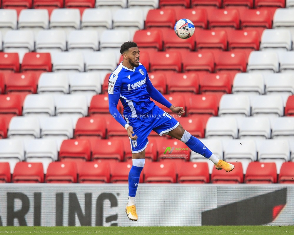 Vadaine Oliver #19 of Gillingham heads the ball