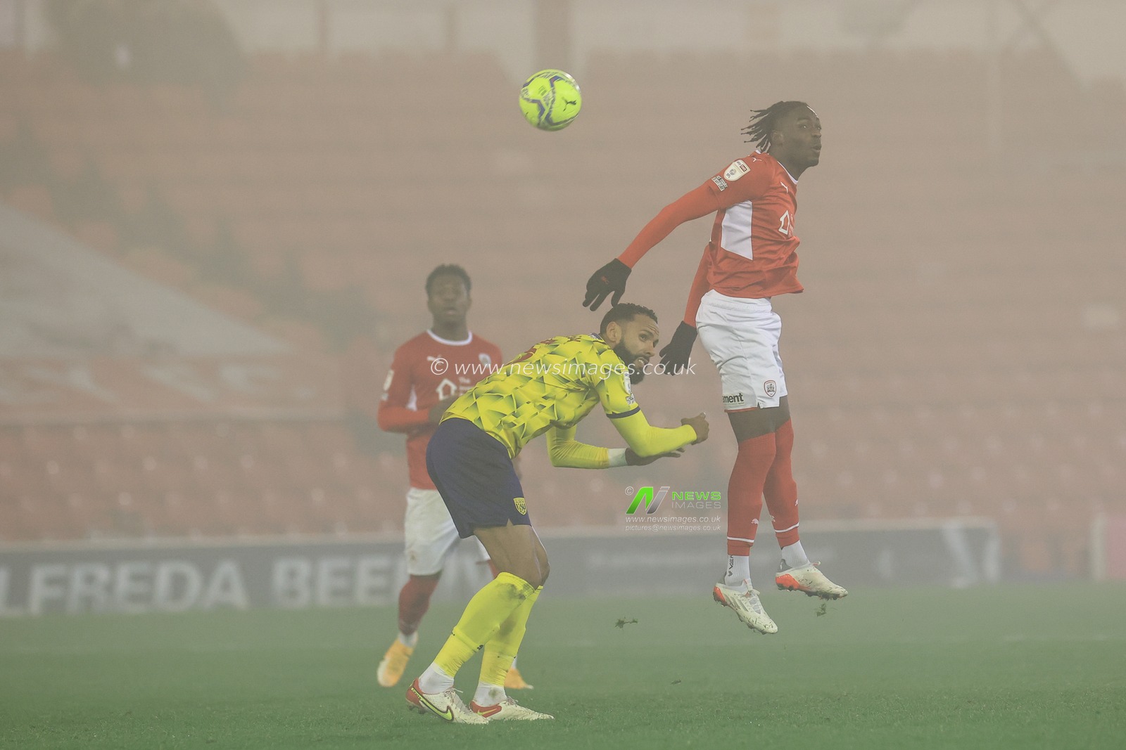 Devante Cole #44 of Barnsley wins the high-ball