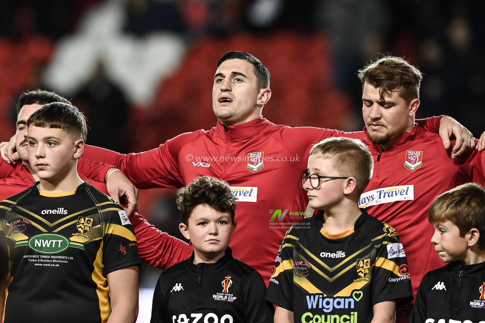 Joe Burke of Wales signs the Welsh National Anthem ahead of the Rugby League World Cup 2021 match Tonga vs Wales at Totally Wicked Stadium, St Helens, United Kingdom, 24th October 2022

(Photo by Craig Thomas/News Images)