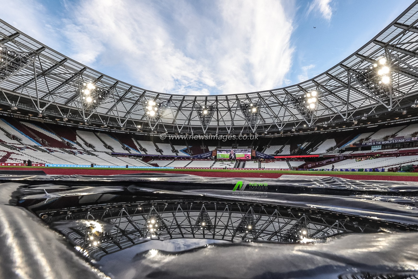 A reflection of the London Stadium through a puddle during the Premier League match West Ham United vs Brentford at London Stadium, London, United Kingdom, 20th October 2025

(Photo by Mark Cosgrove/News Images)